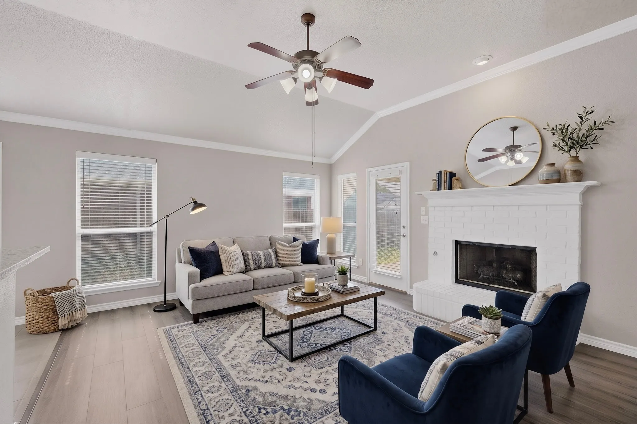 Staged Living Room with Gas Fireplace with Gas Starter and New Laminate Flooring