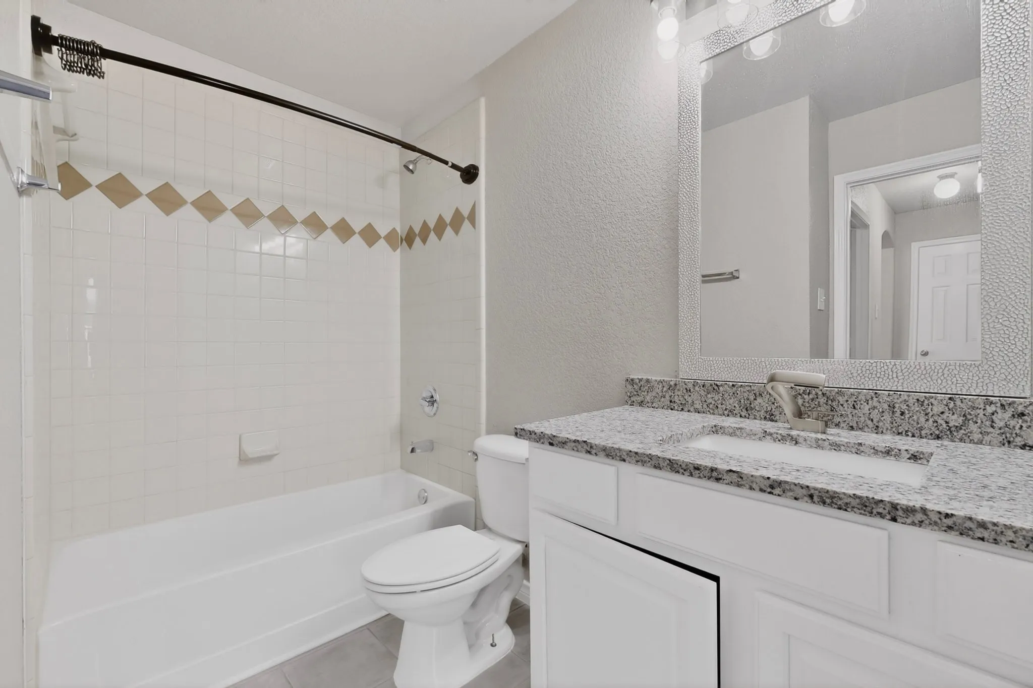 Hall Bathroom Connects to Bedroom # 2 to the Hallway-  Bathroom with New Granite Countertop, New Faucet and New Flooring