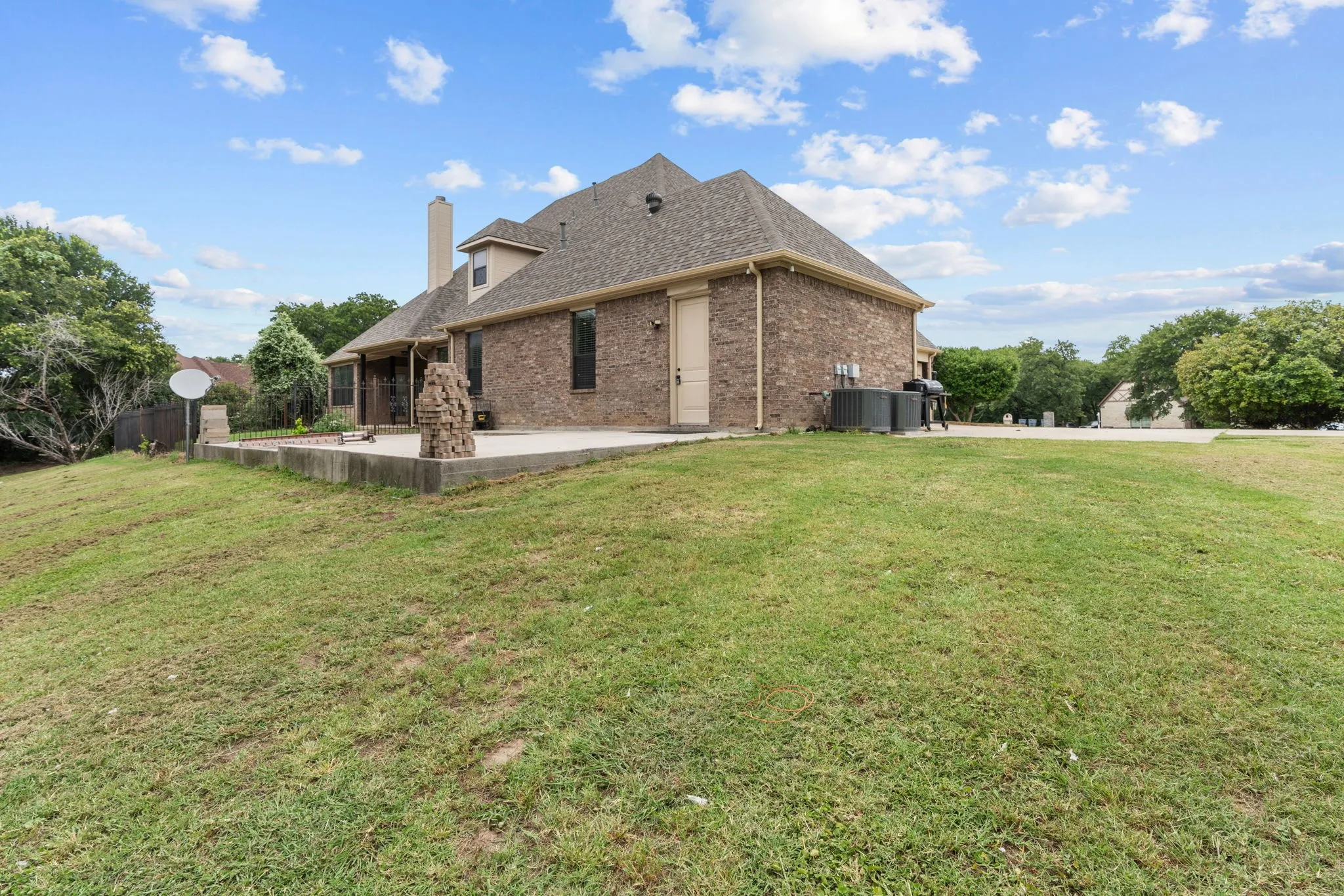 Back of property featuring a patio and a yard
