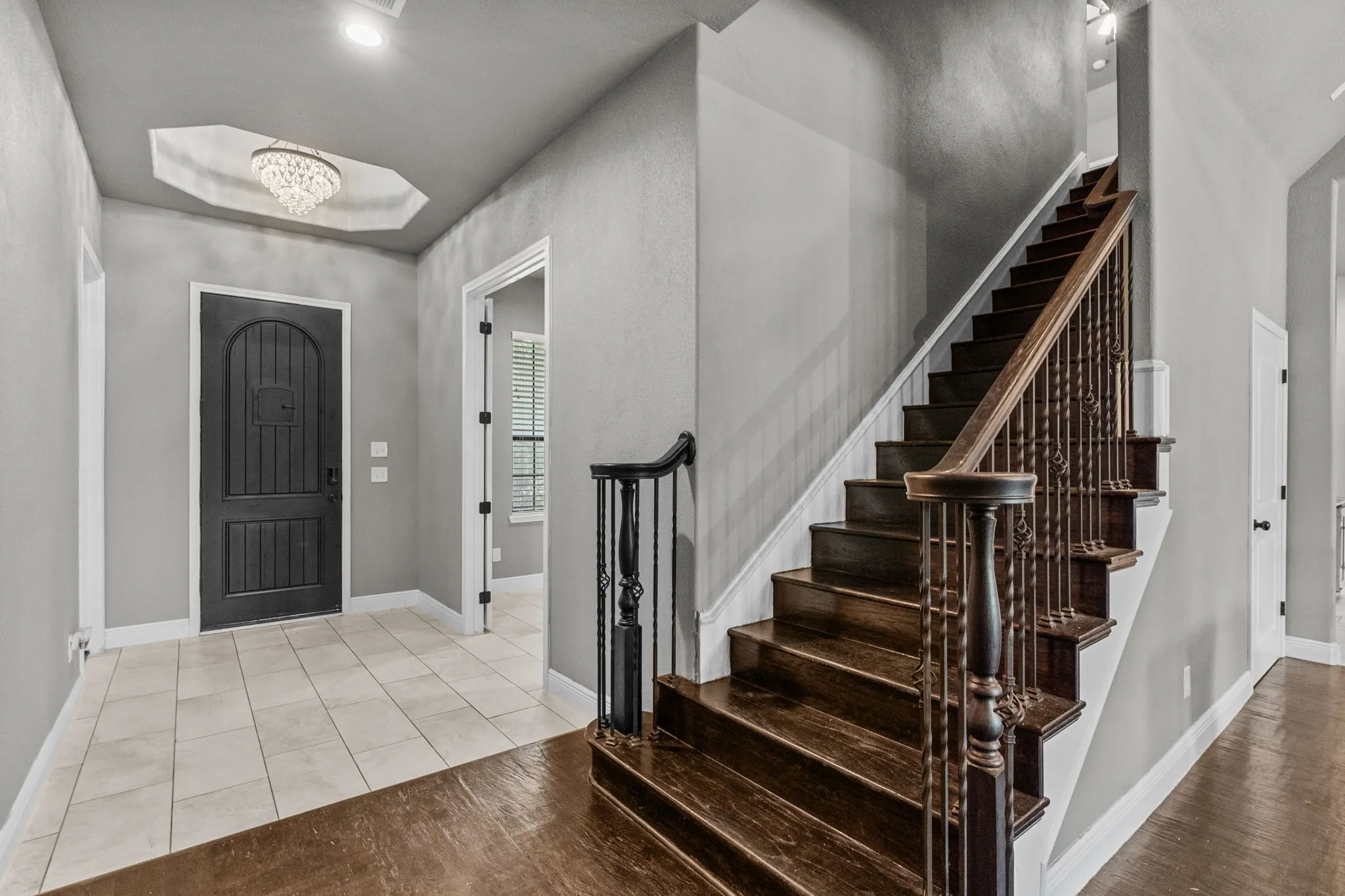 Foyer with light hardwood / wood-style flooring