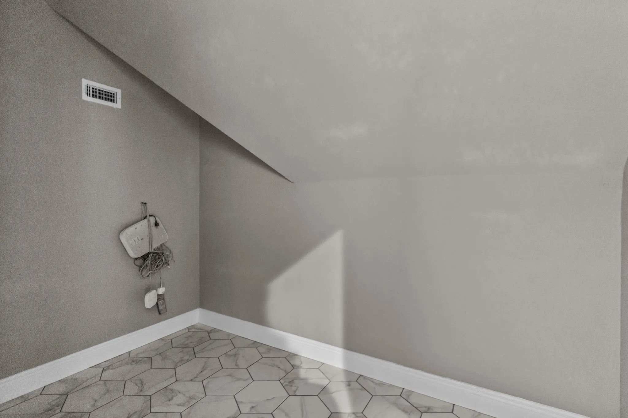 Washroom with tile patterned floors