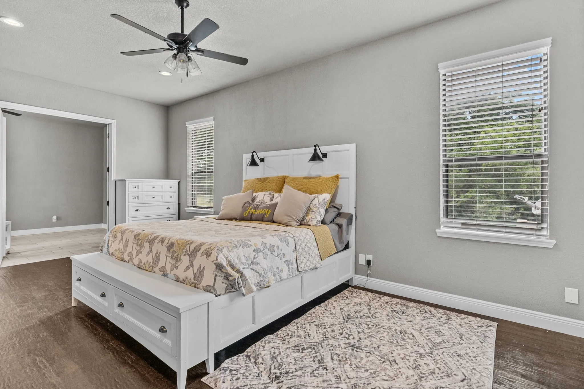 Bedroom featuring dark hardwood / wood-style floors and ceiling fan