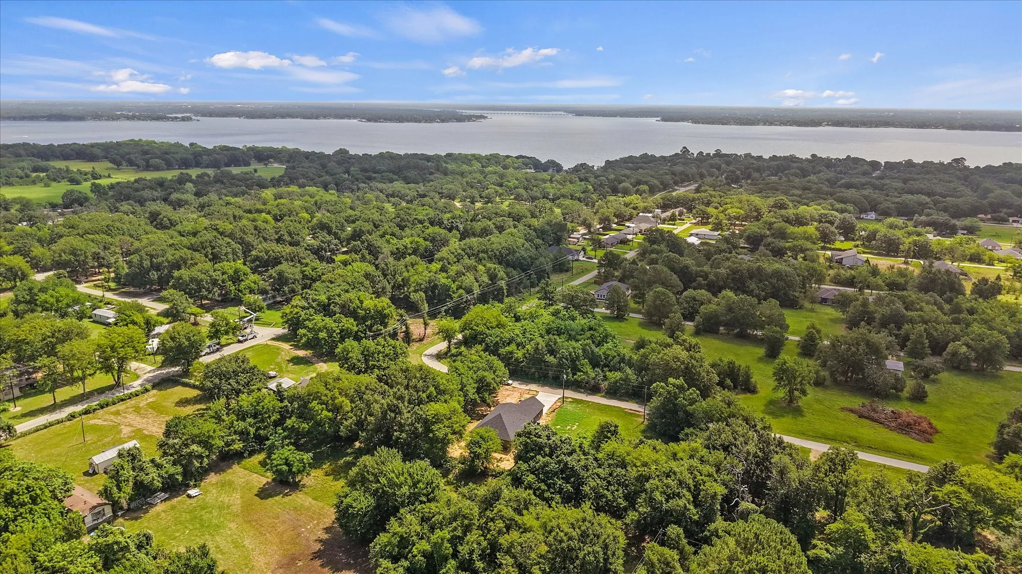Sprawling residential area featuring abundant mature trees and expansive green spaces