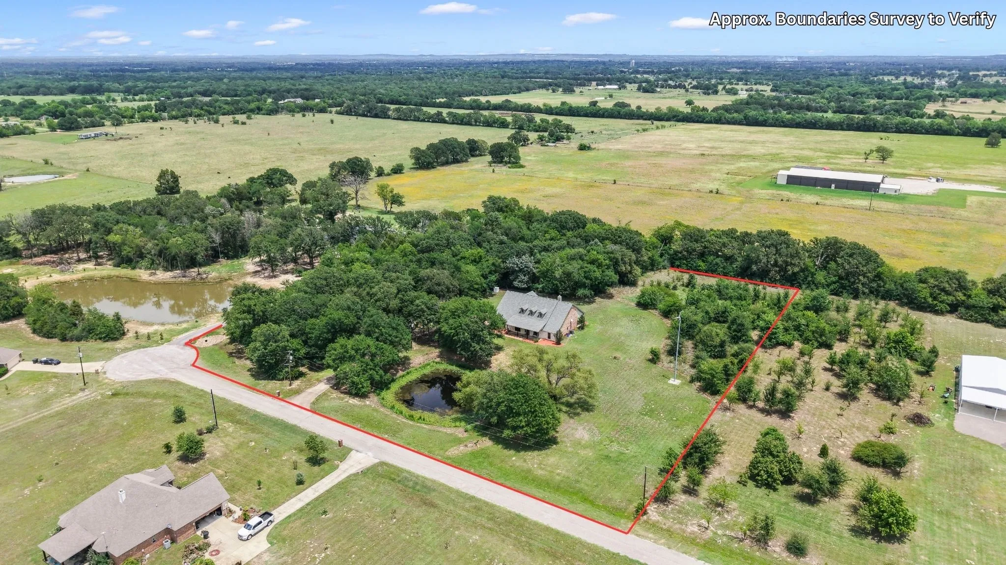 Approximate Aerial view showcasing nearly 5 acres of peaceful East Texas countryside.