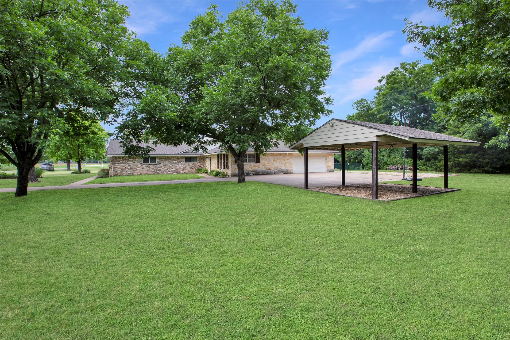 View Across Side Yard Through Two Auto Carport.