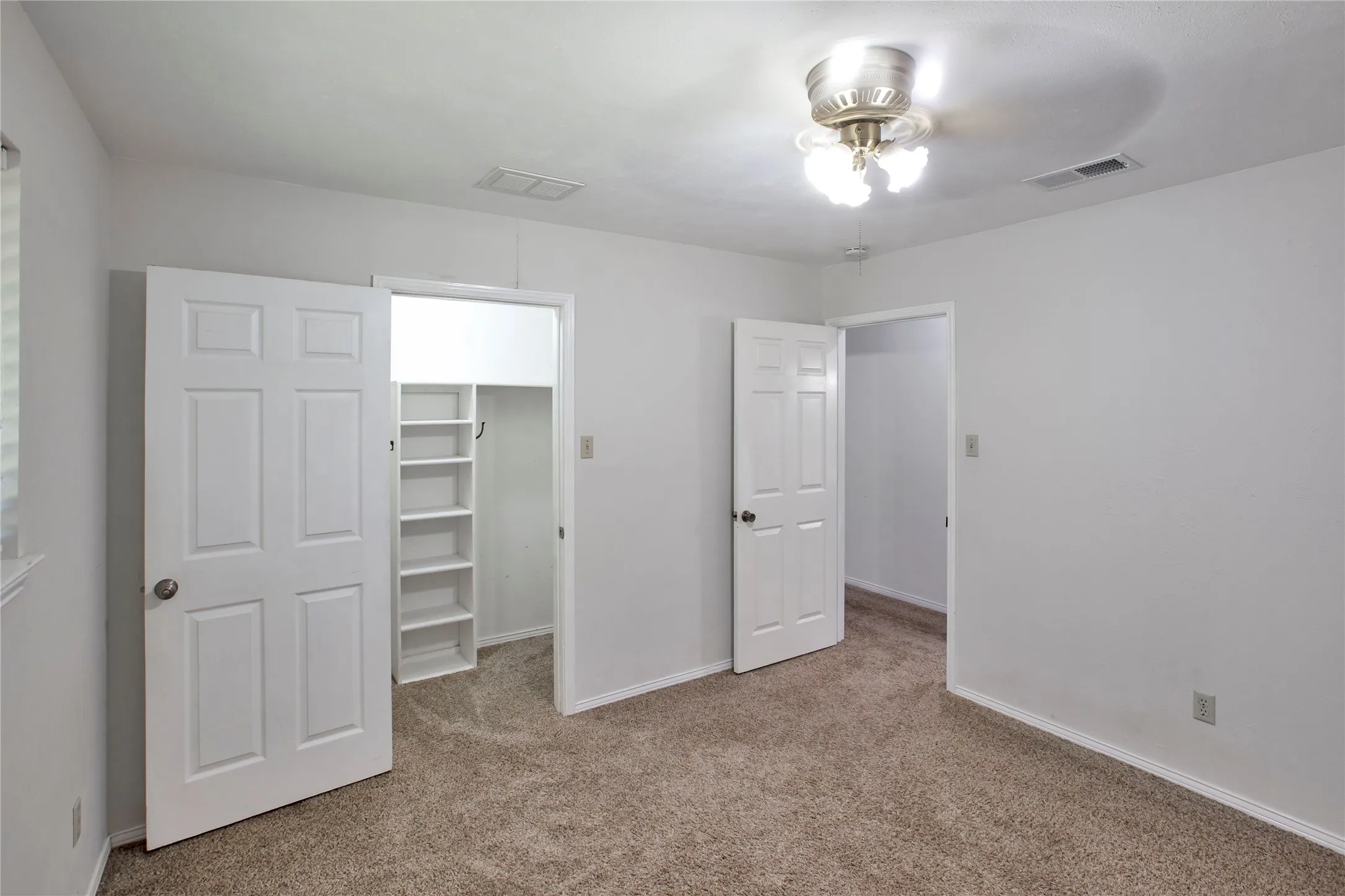 View#2 2nd Bedroom Look Into Large Closet.
