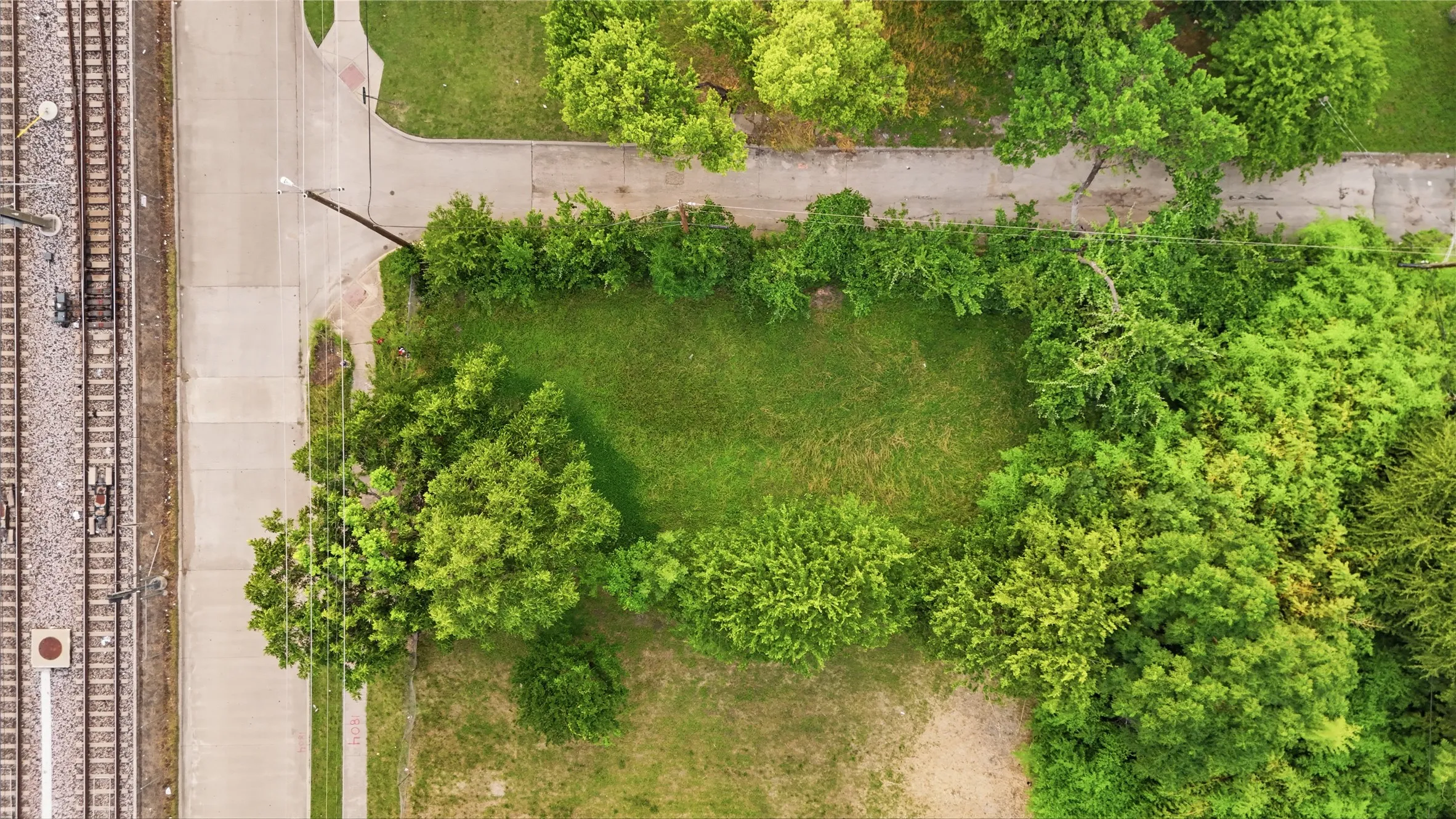 Expansive parcel featuring a manicured lawn, mature trees, and direct frontage on a paved​​‌​​​​‌​​‌‌​‌‌​​​‌‌​‌​‌​‌​​​‌​​ road