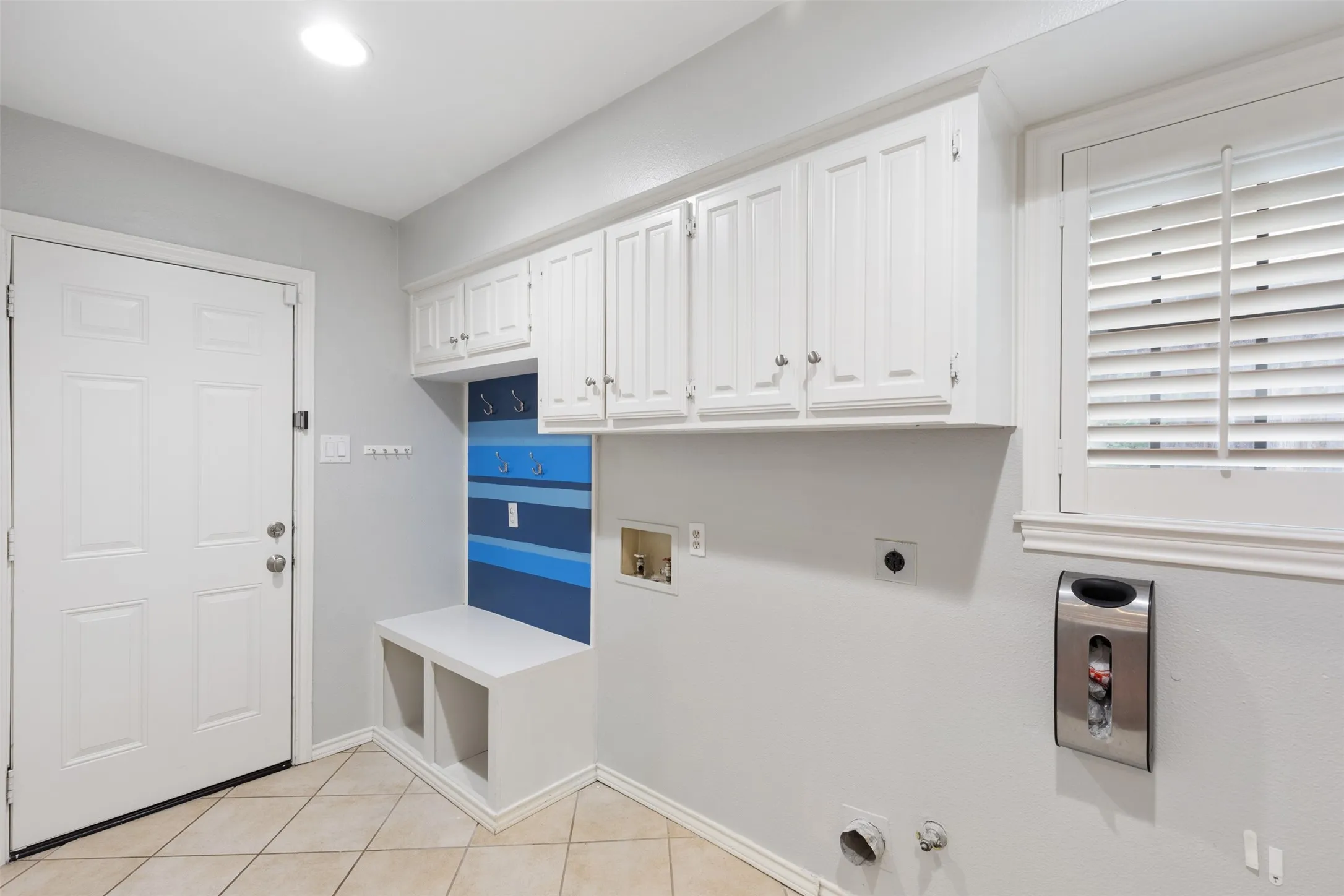Full size laundry room with mud area directly off the garage.