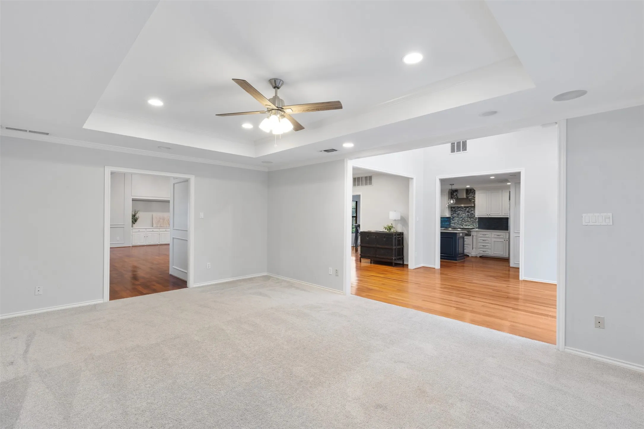 View from Game room into main living area and dining room.