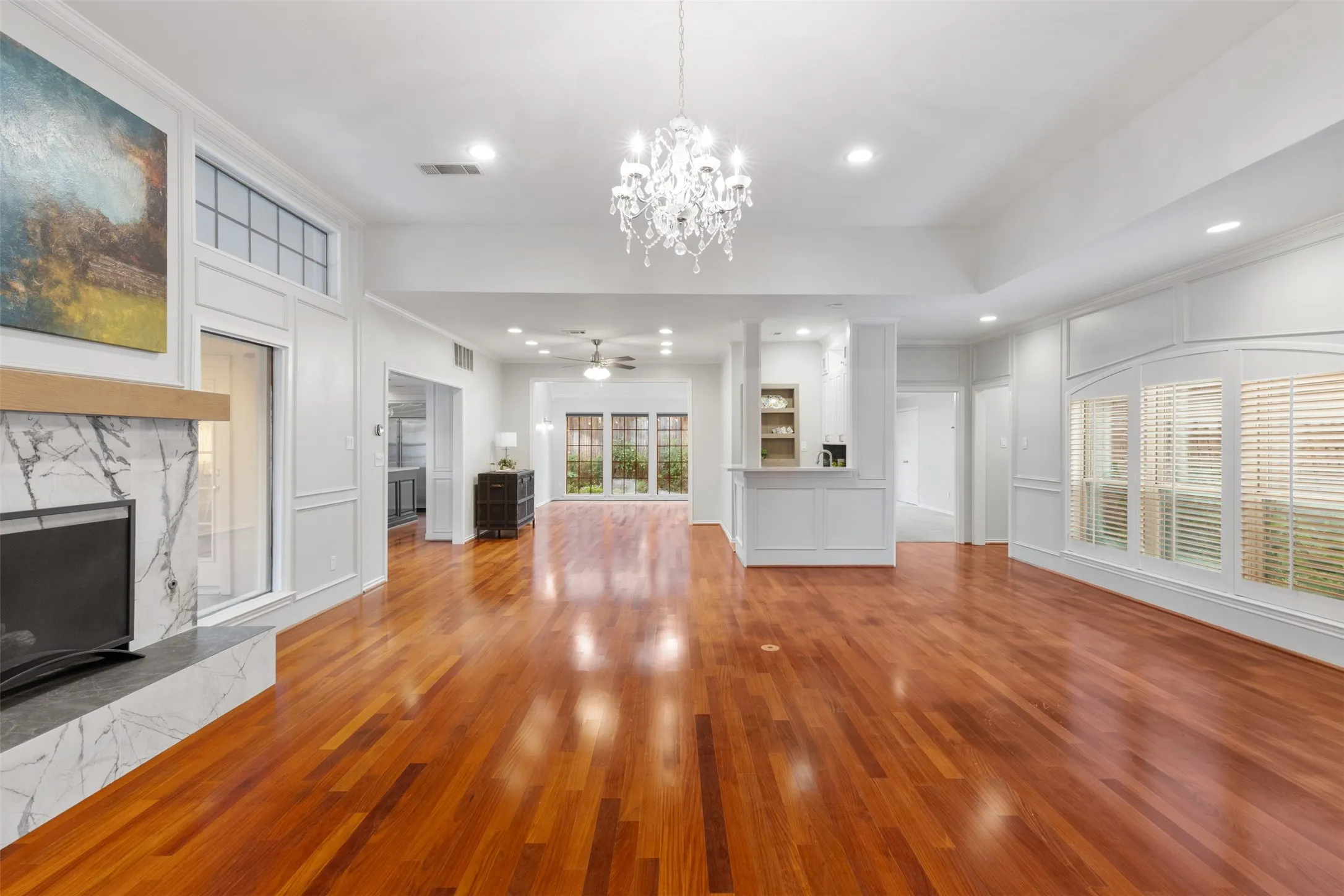 View looking toward built-in wet bar and dining room