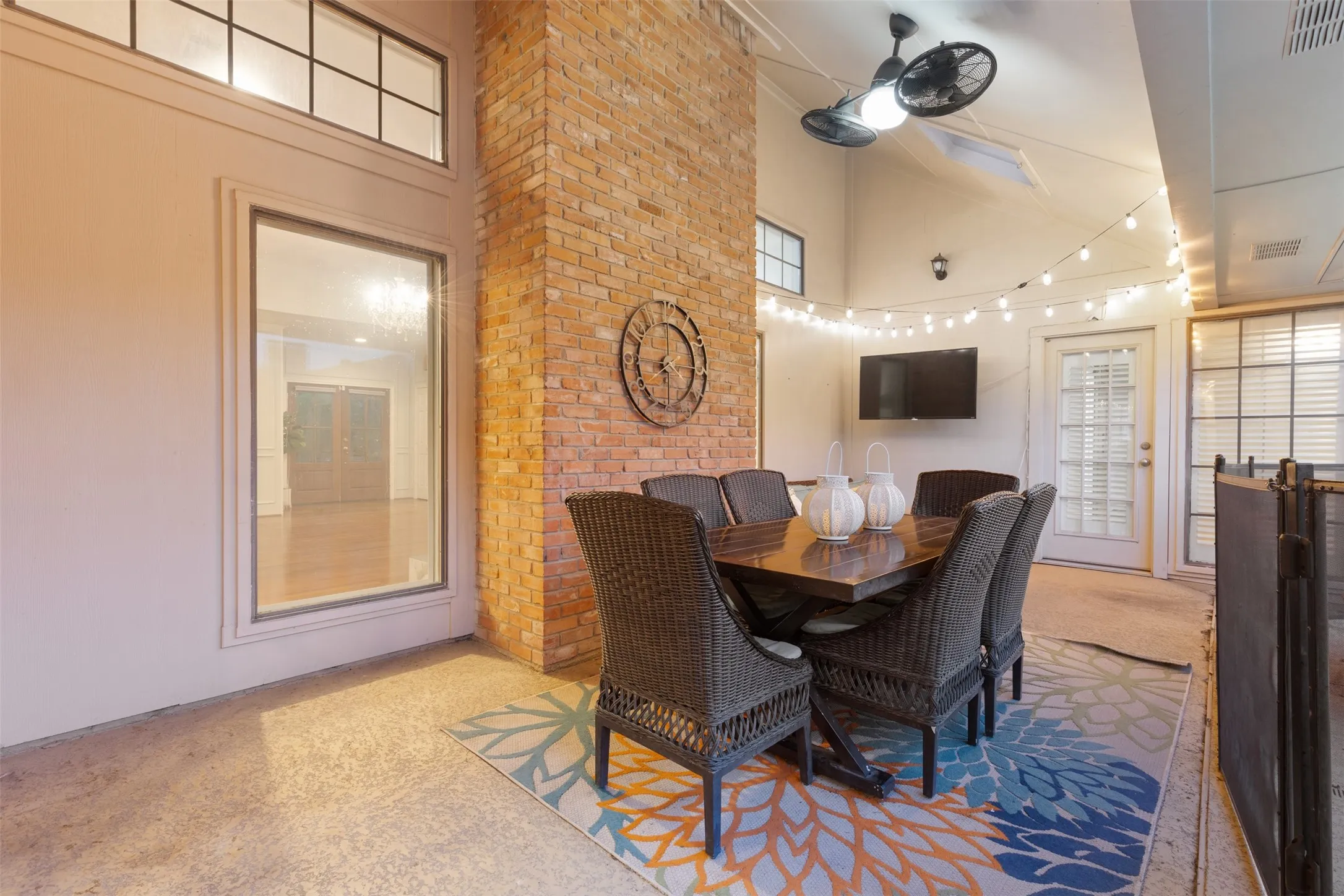 Outdoor entertaining area, view into main living area and primary bedroom back door.