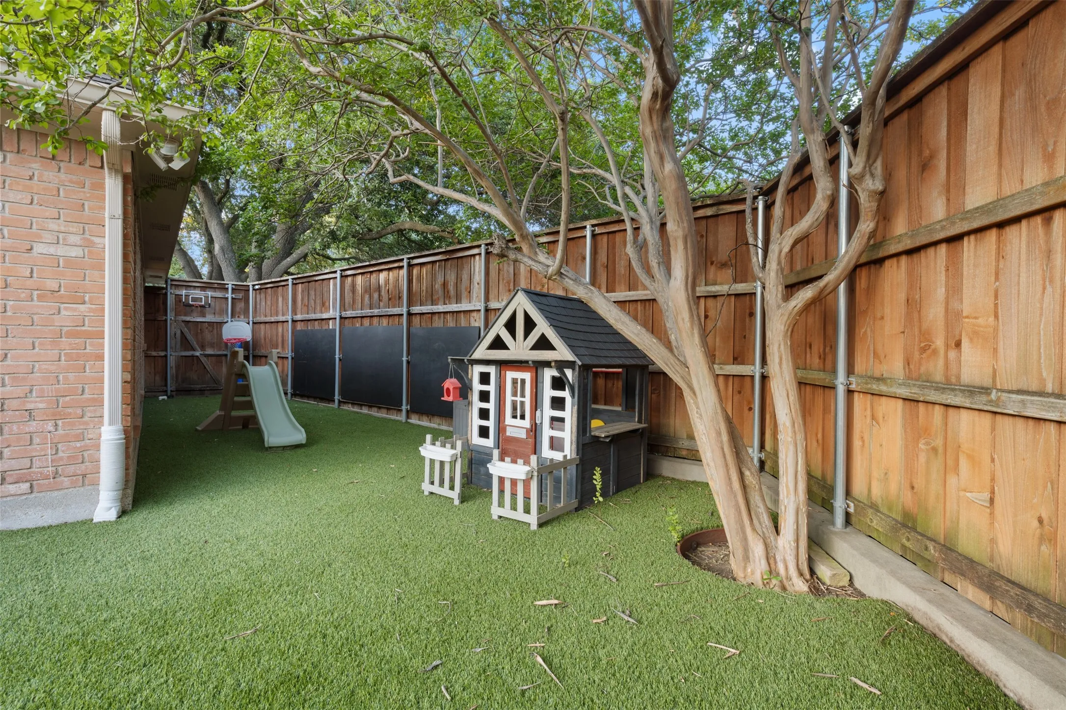 Large turfed area on side of house for playing.