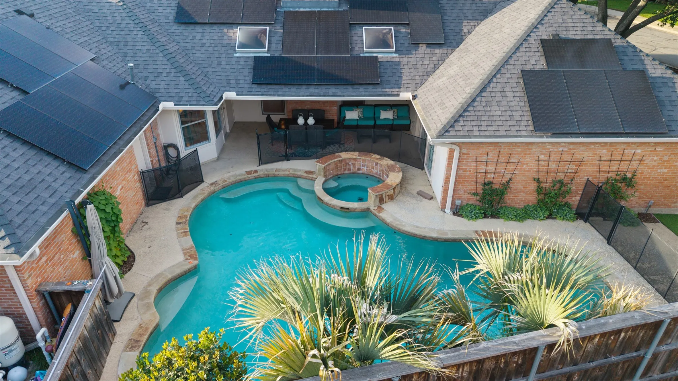 Backyard with pool and solar panels.