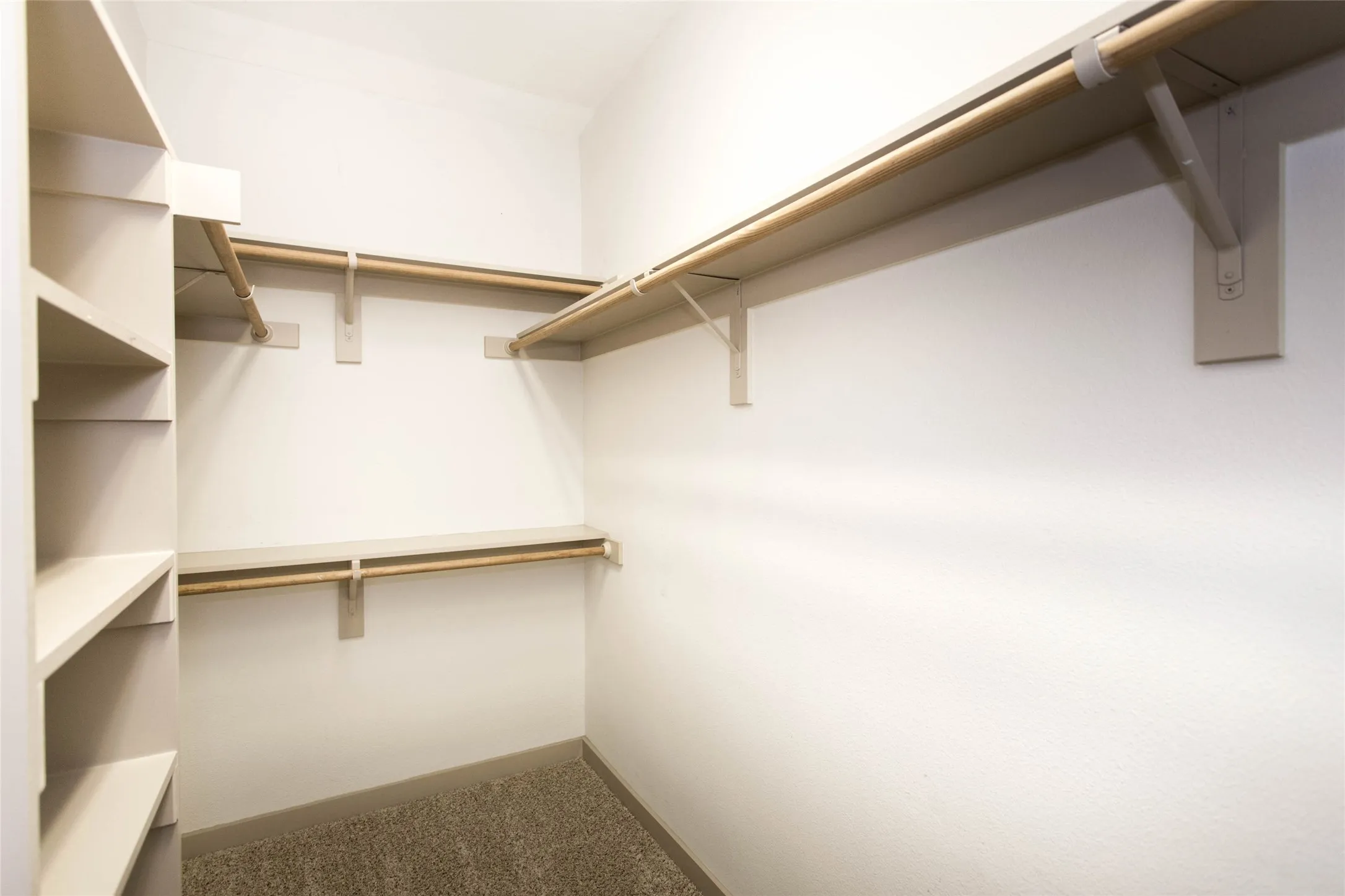 Walk-in closet in primary bedroom
