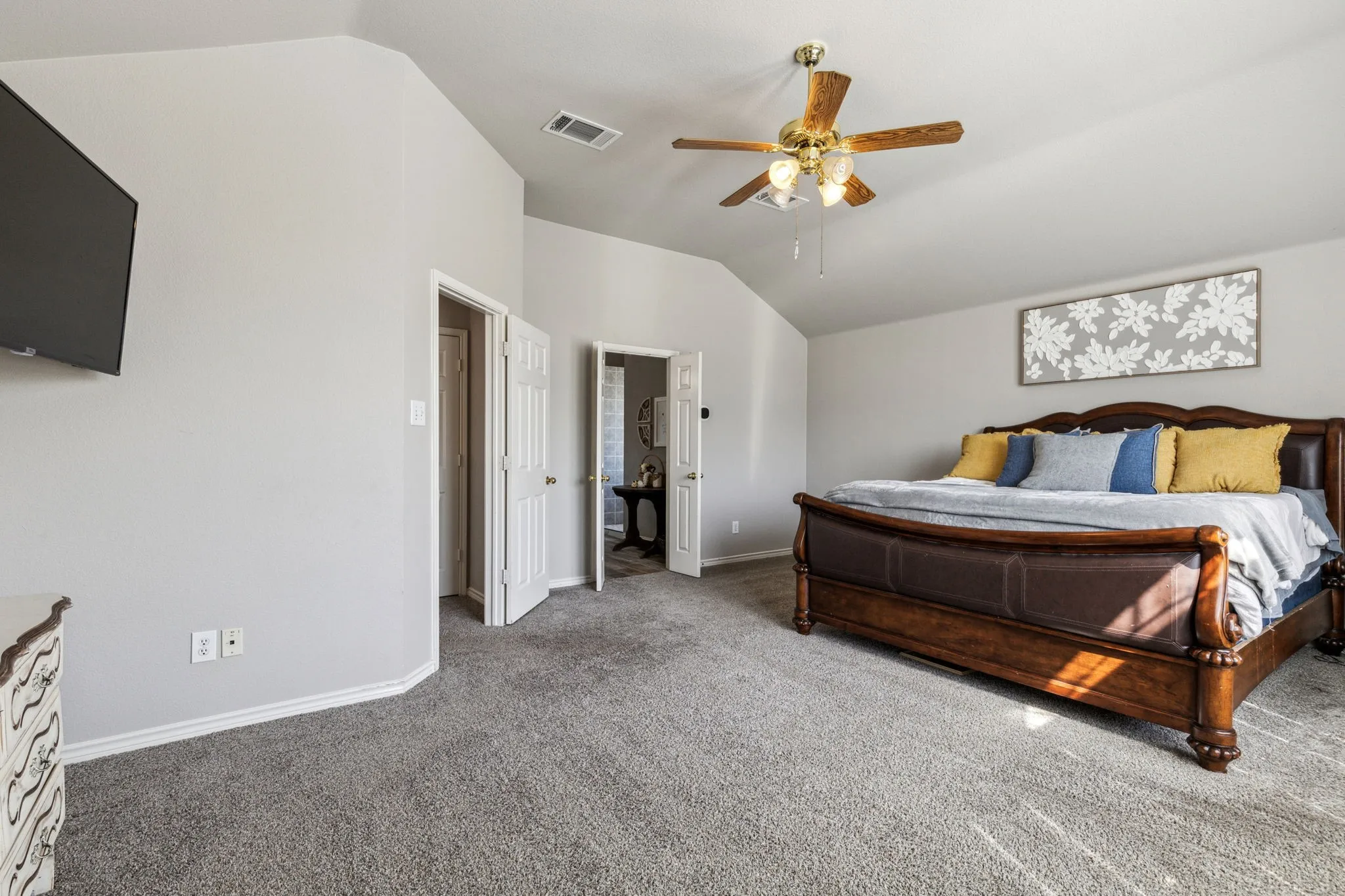 Lots of room for king bed, bedroom furniture and TV.