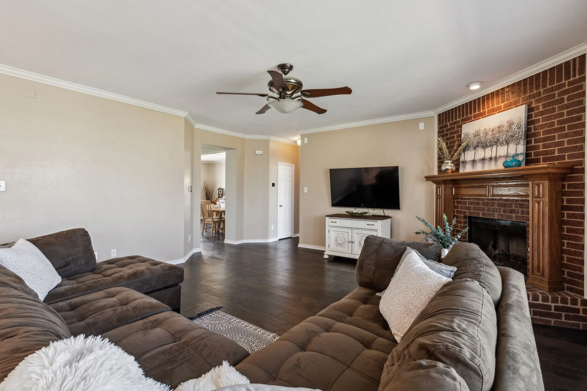 Another view of the living room. Office, full bath and dining area through the entry hall.