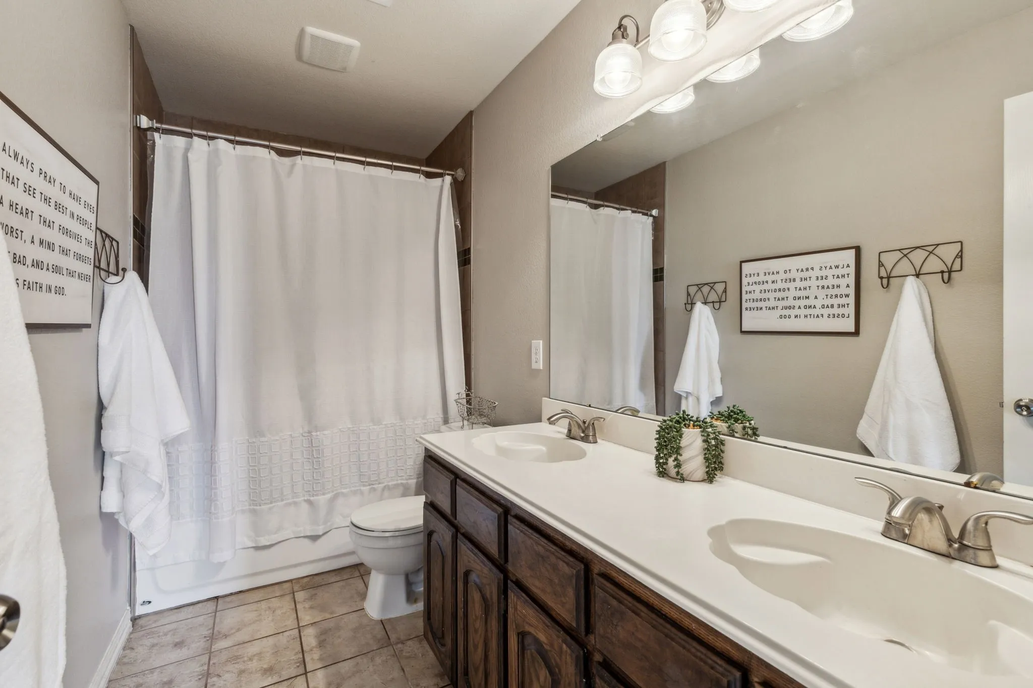 Upstairs bath services the secondary bedroom and game room.