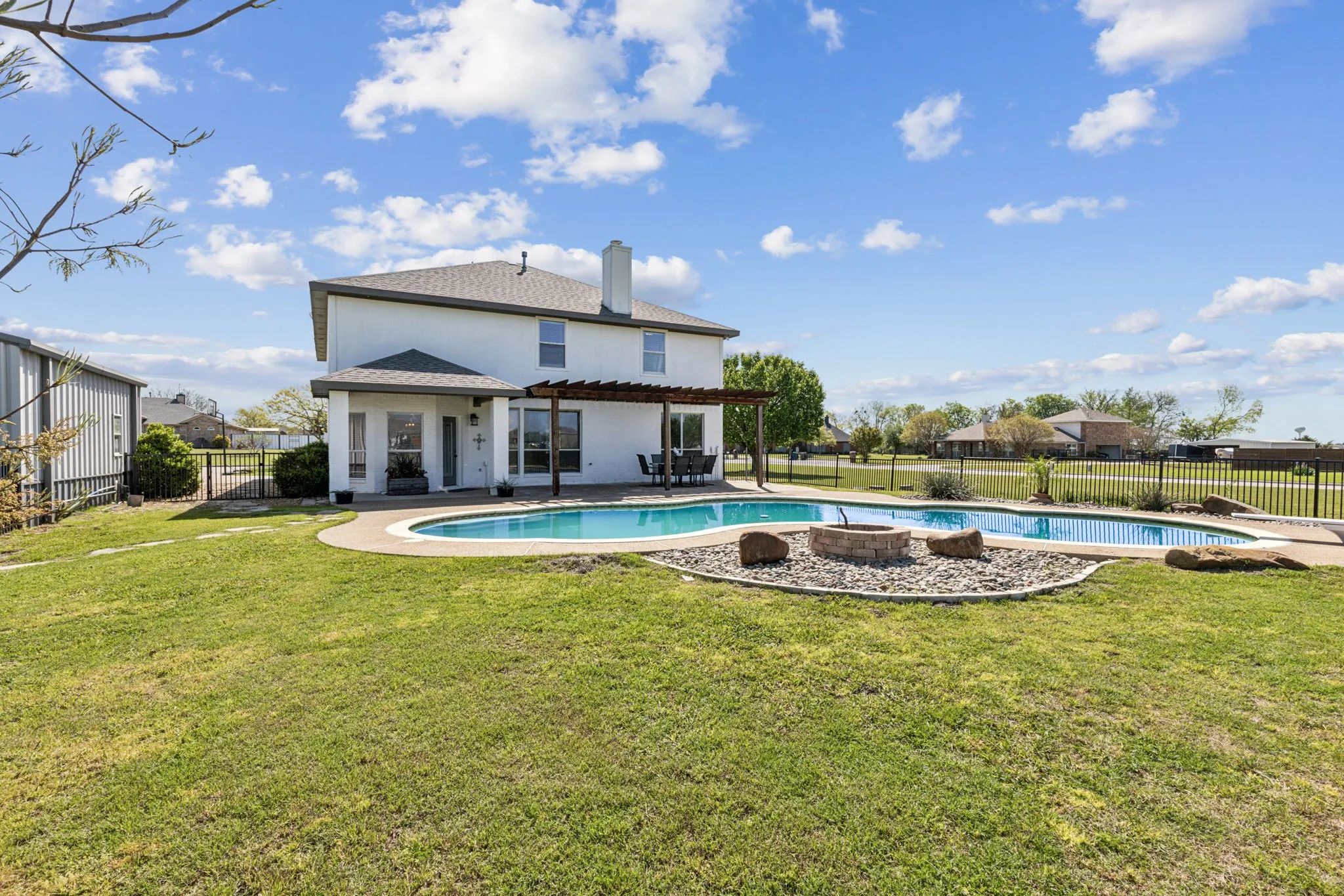 View toward the back of the house, pool, patio and yard!