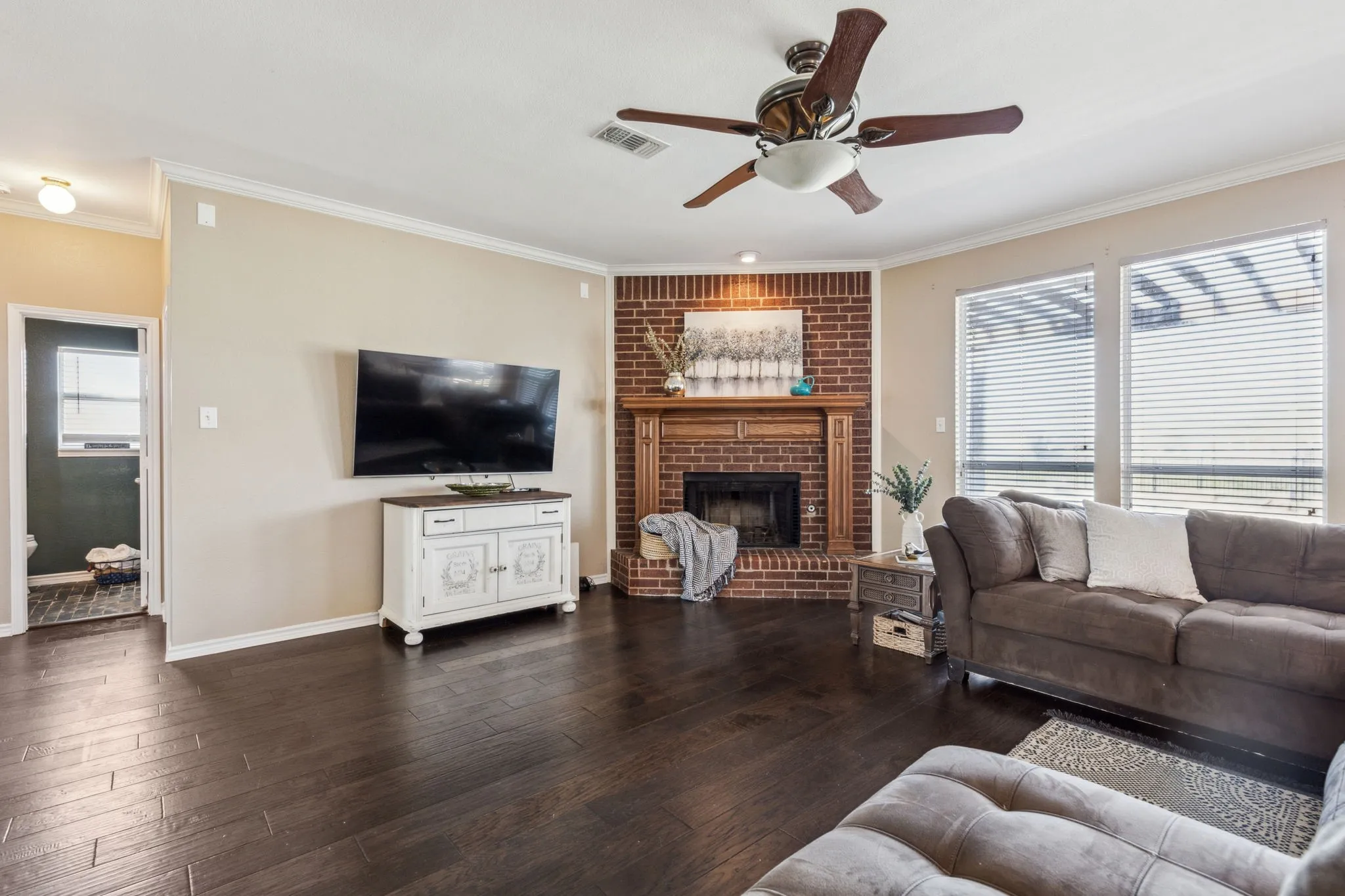 Enjoy a cozy living area with gas brick fireplace.