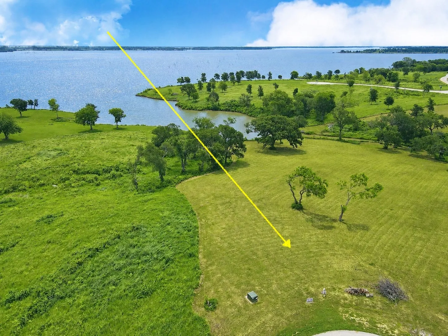Elevated lakefront views highlight the size, shoreline, and homesite potential of Lot 53.