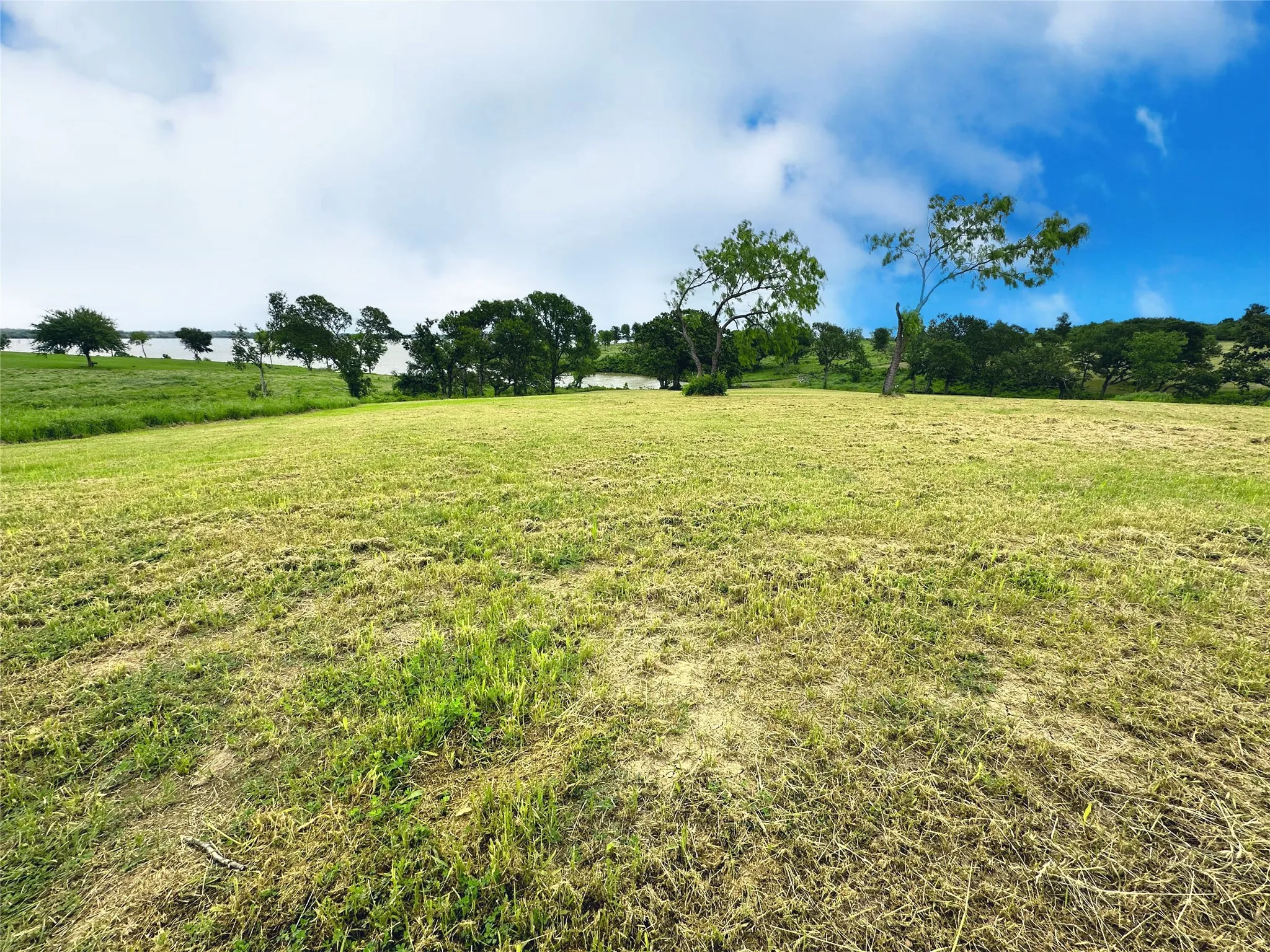 Gently sloped build site offers room for a custom lake home near Corsicana, Texas.