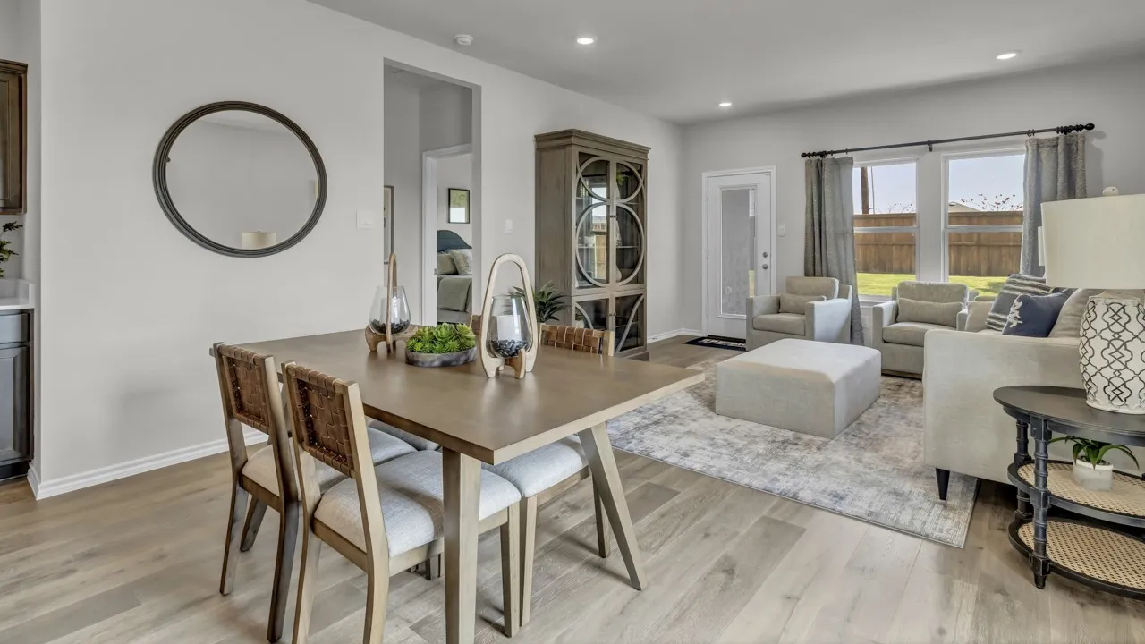 Open concept living and dining area featuring wood-finish flooring, recessed lighting, and a neutral color palette