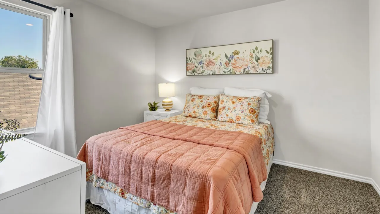 Bedroom featuring light gray walls and carpeted flooring