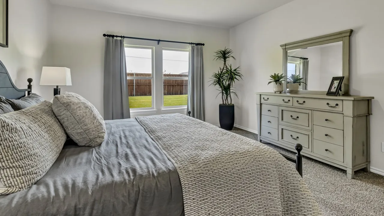 Bedroom featuring neutral wall colors and carpeted flooring