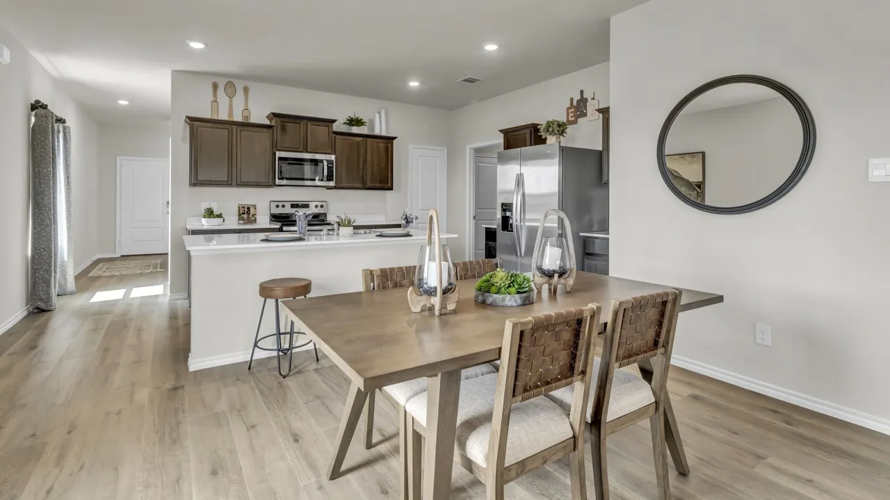 Open-concept living space with wood-finish flooring