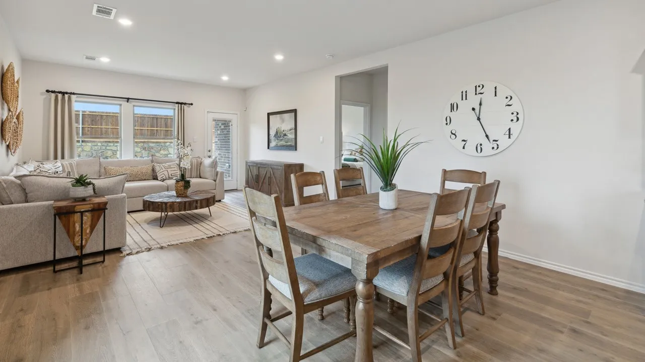 Open-concept living area featuring wood-finish flooring throughout