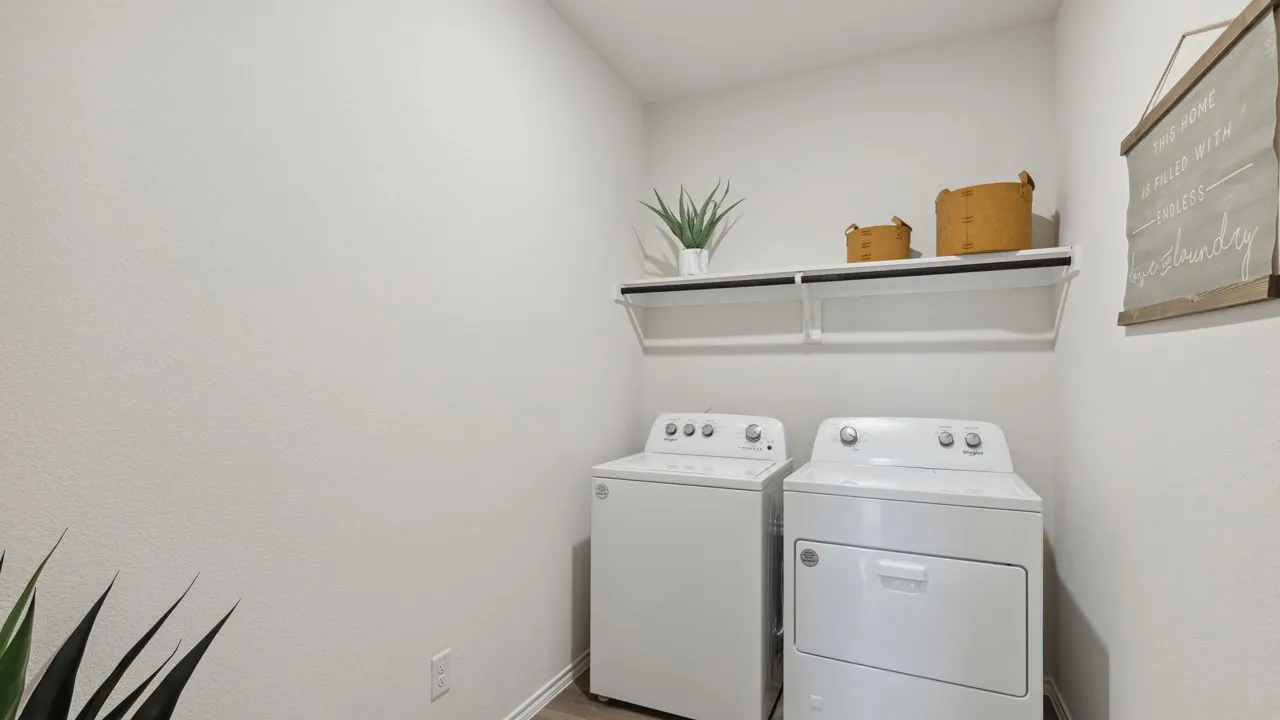 Dedicated laundry area featuring a white wall-mounted shelf with integrated hanging rod