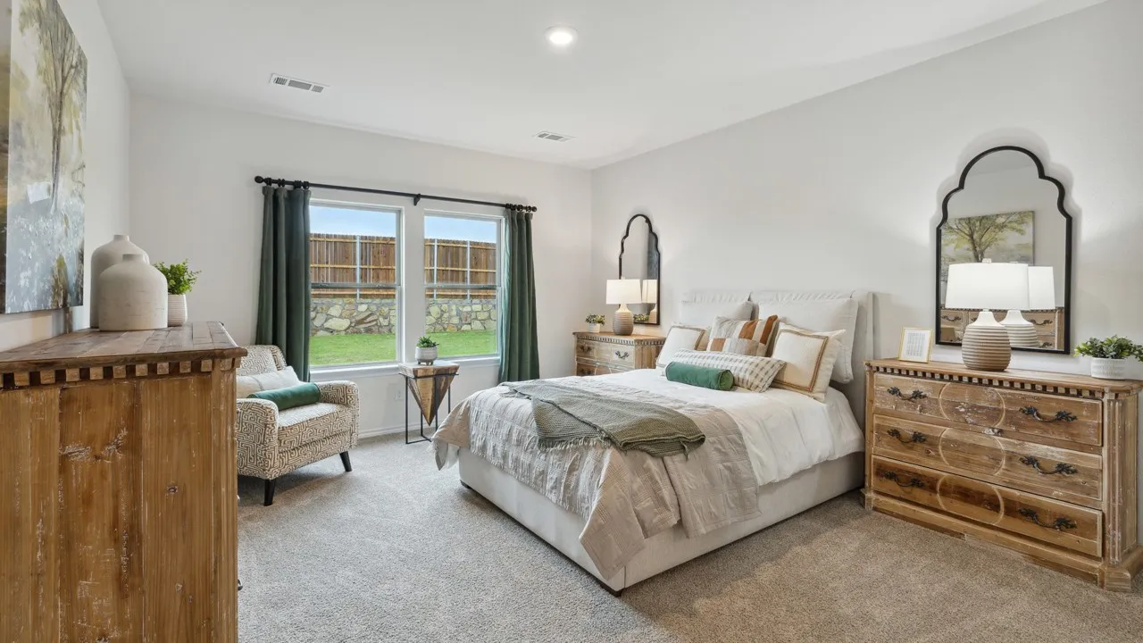 Spacious room featuring light-colored carpeting and white walls