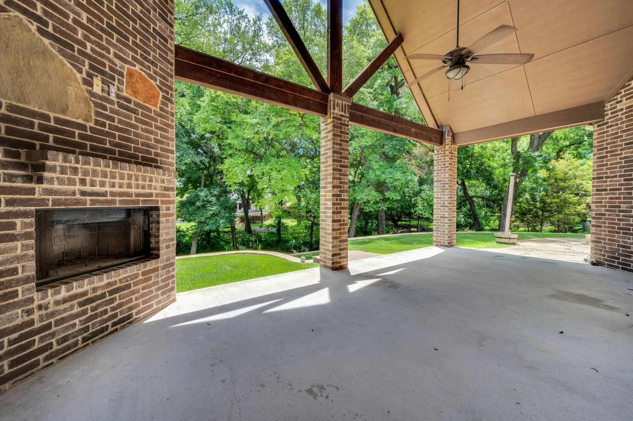 Massive back porch with fireplace and the most peaceful view