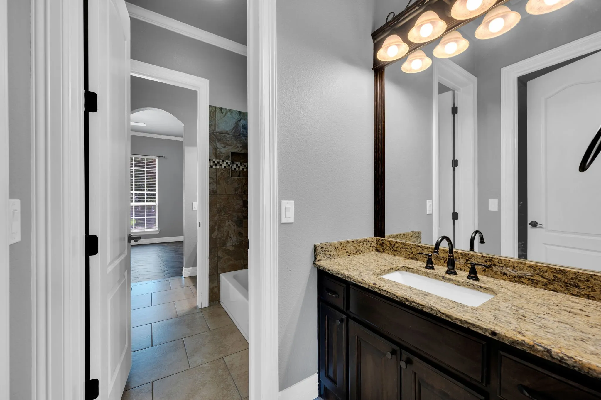 Full bath with separate sides for sinks