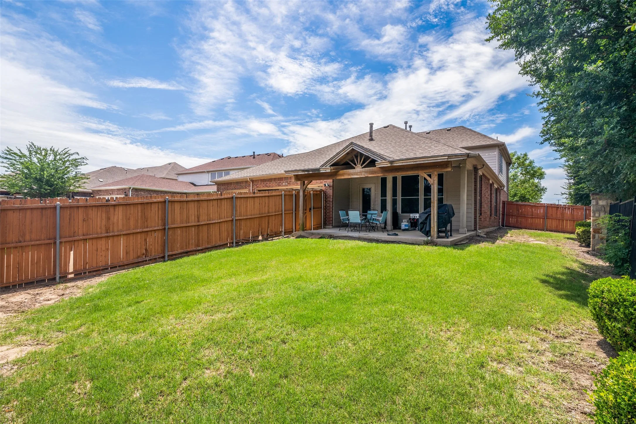 Covered porch and private backyard.