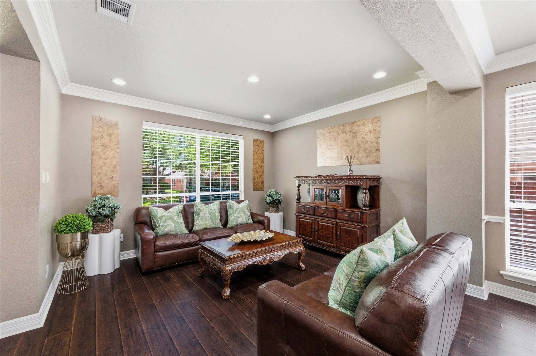 Living Rm with engineered wood, recessed lighting, cand rown molding.