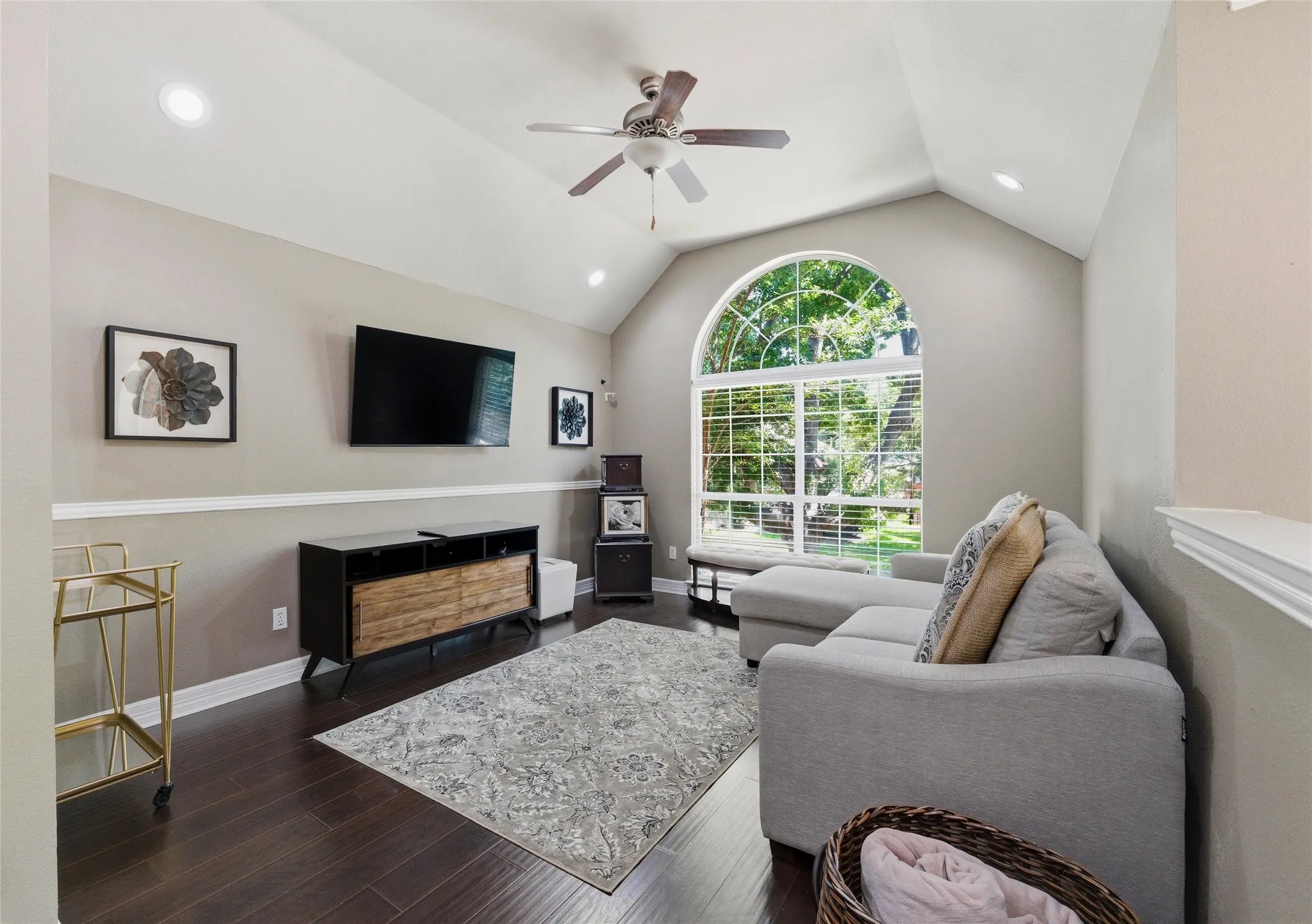 Upstairs gameroom has engineered wood floors, lots of light, and ceiling fan.
