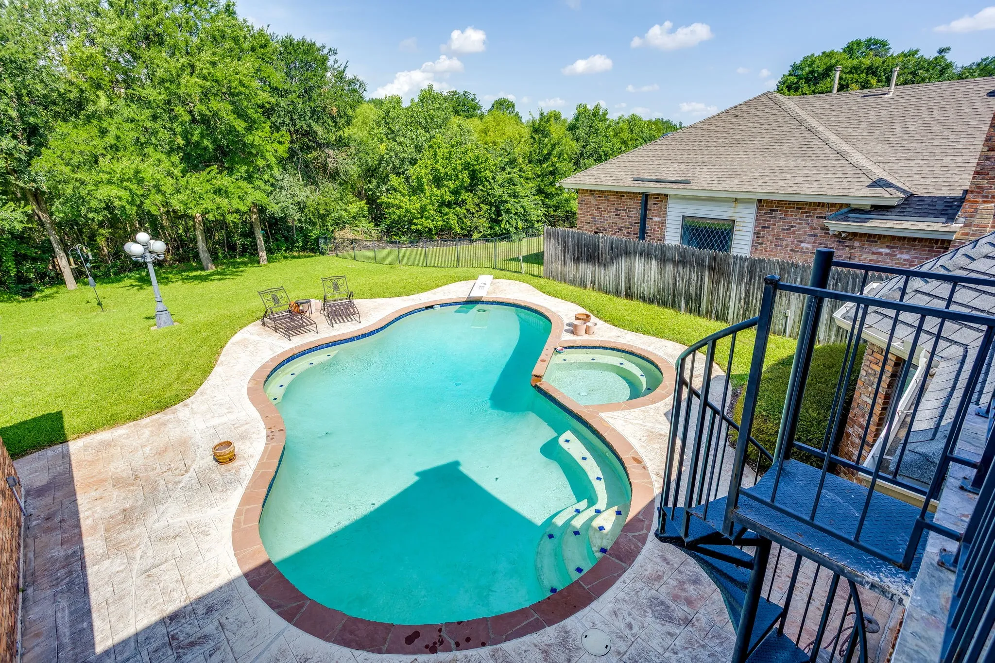 View of Pool and Backyard from Balcony