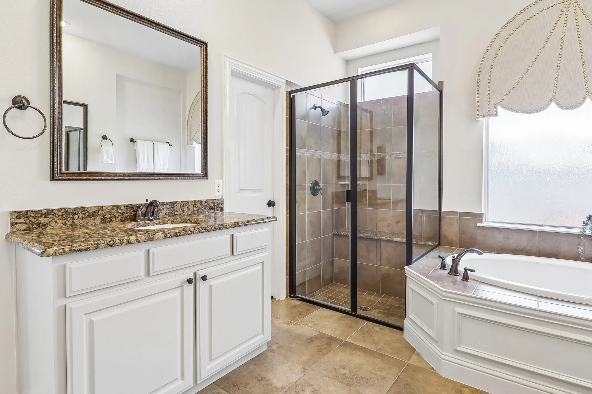 Primary Bathroom with Separate Shower and Soaker Tub