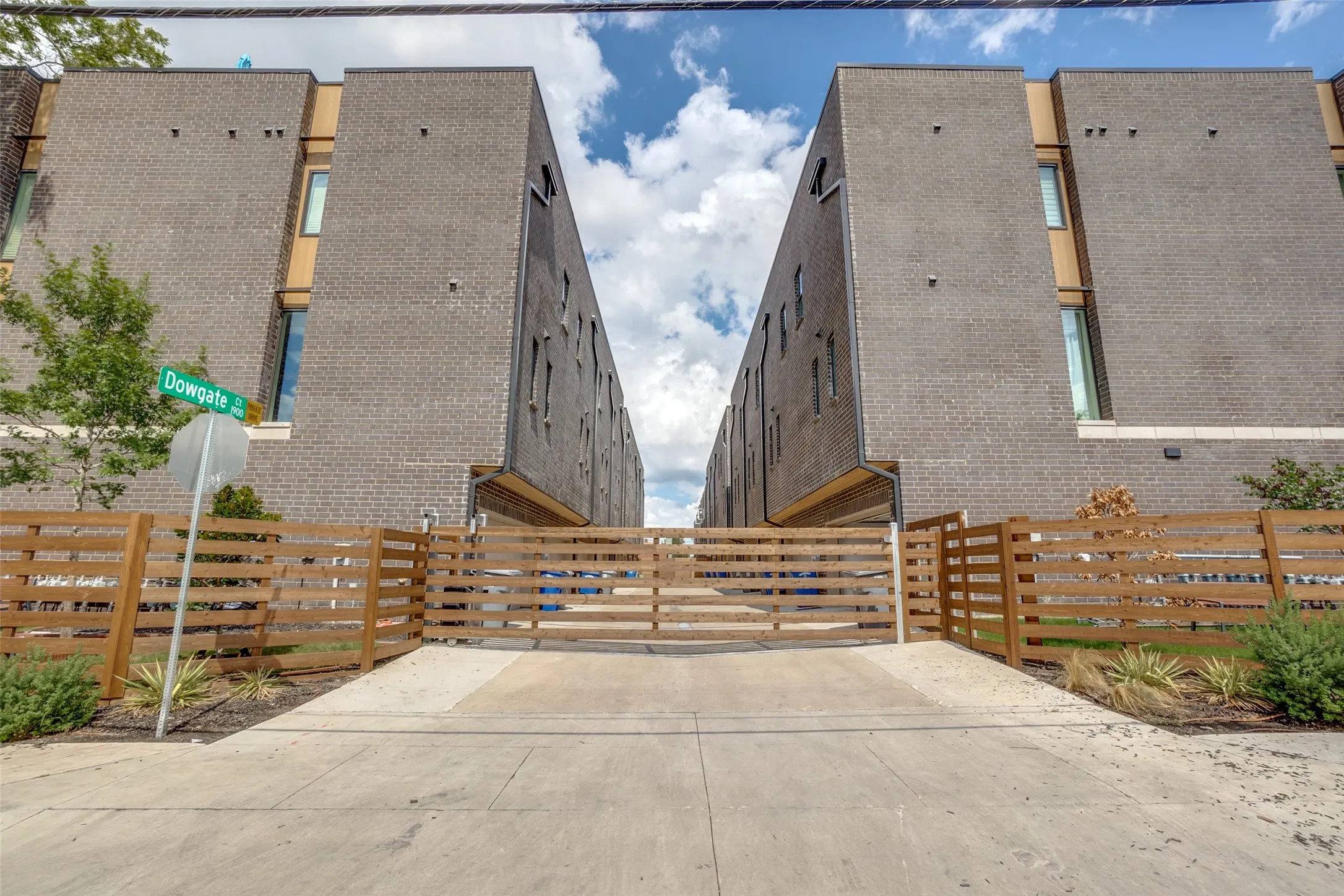 Modern townhome in gated Drayton Court with downtown Dallas skyline views.