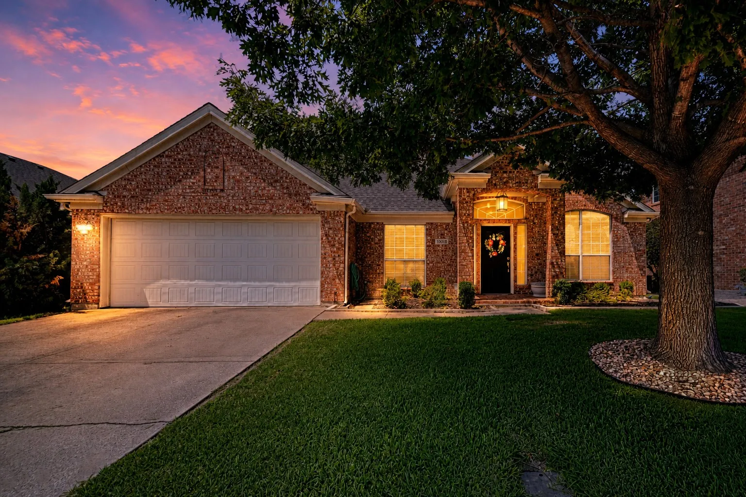 Brick exterior with an attached two-car garage