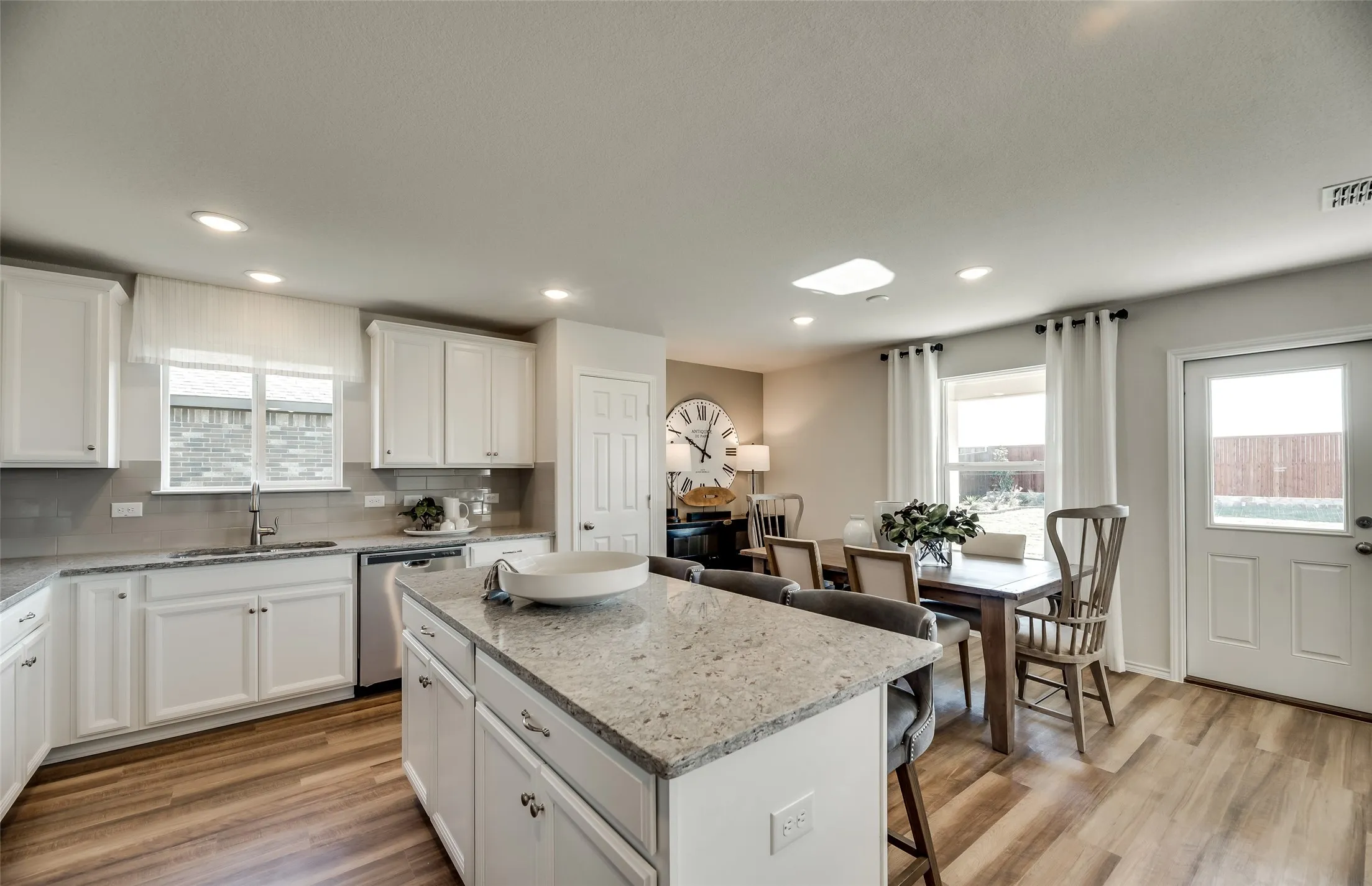 *Model Representation - Dining area off kitchen with large windows