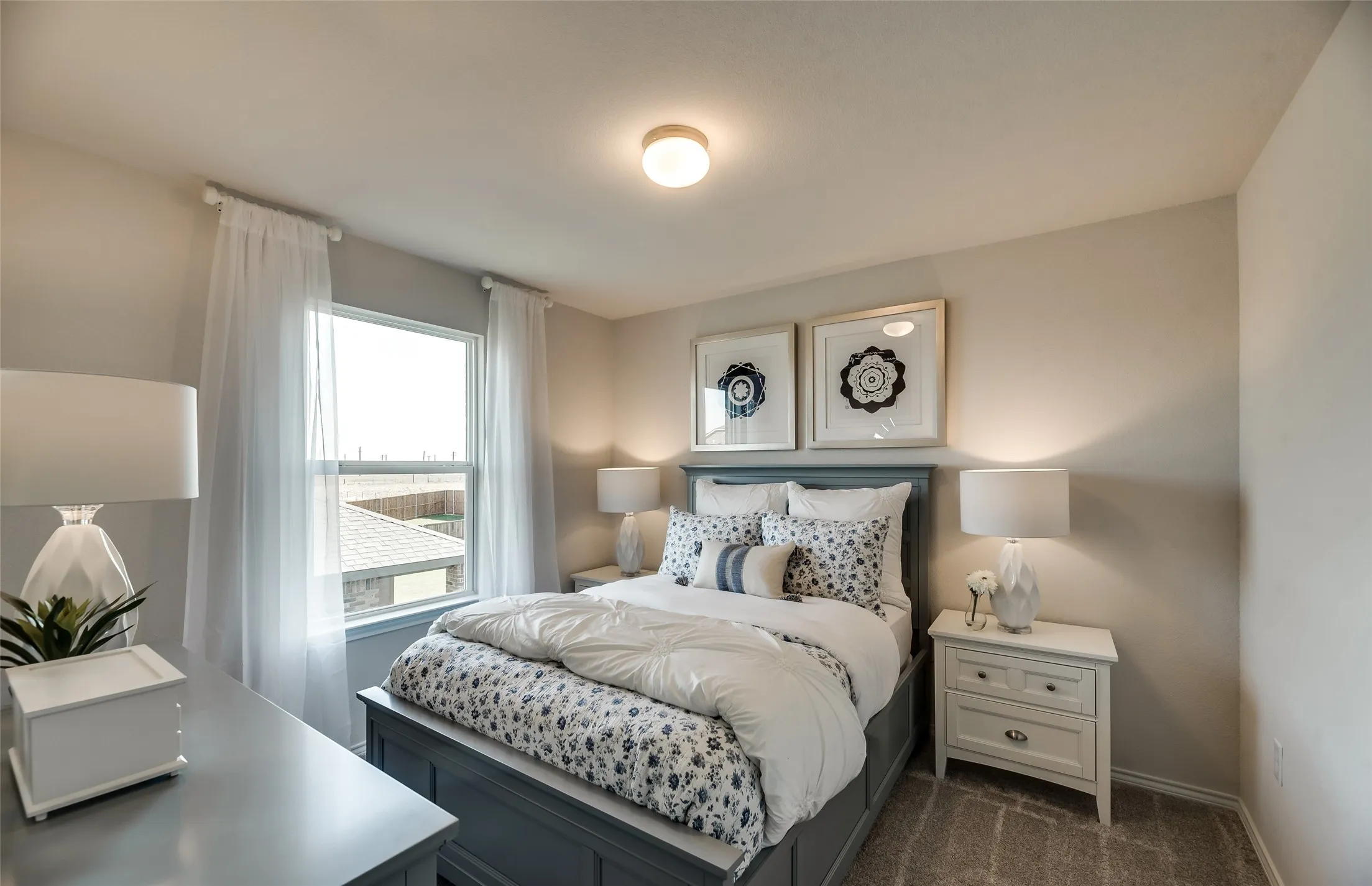 *Model Representation - Spacious secondary bedroom with large windows