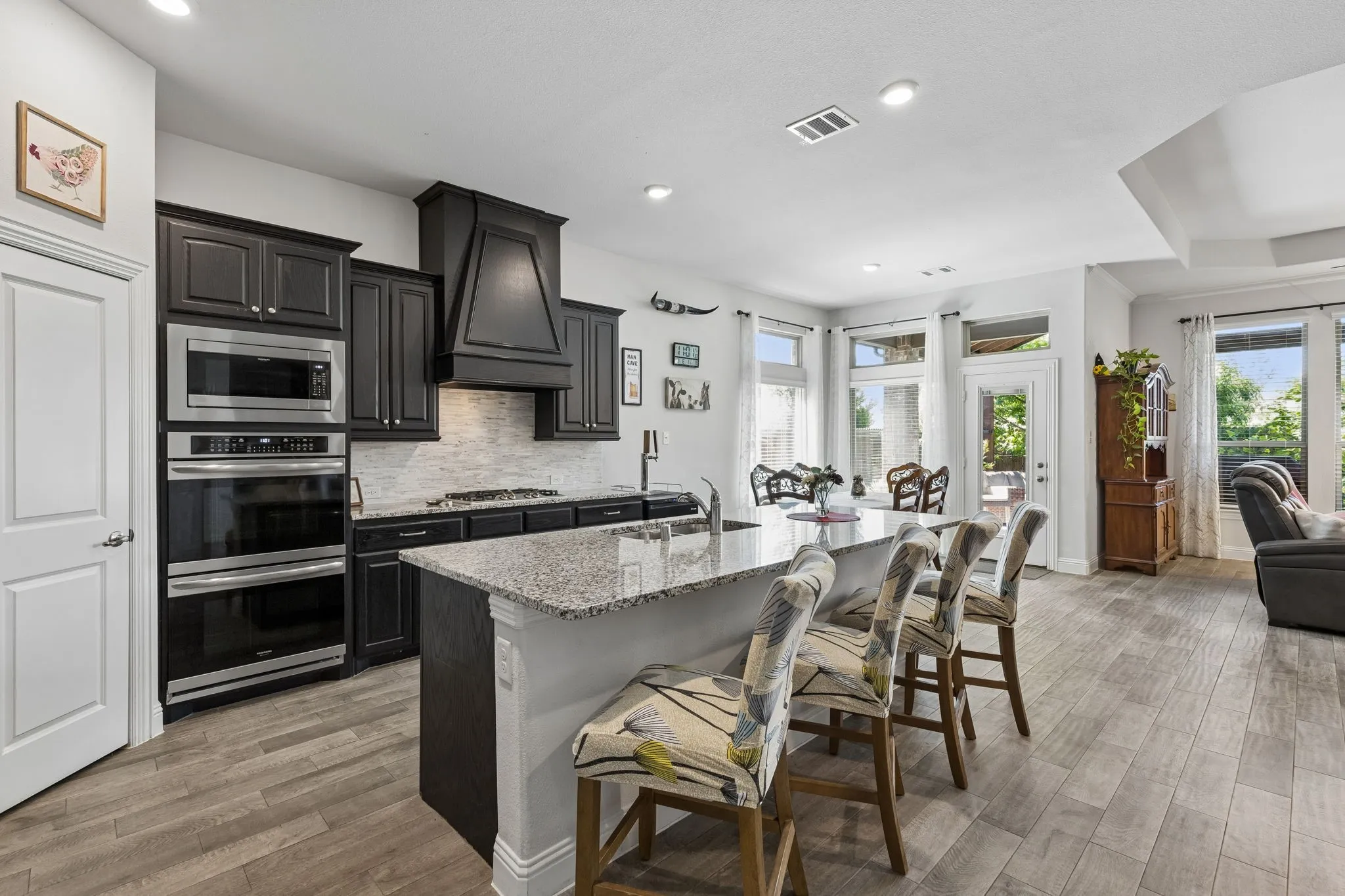 Whether dining at the spacious island or in the large dining space.. everyone has a seat here!