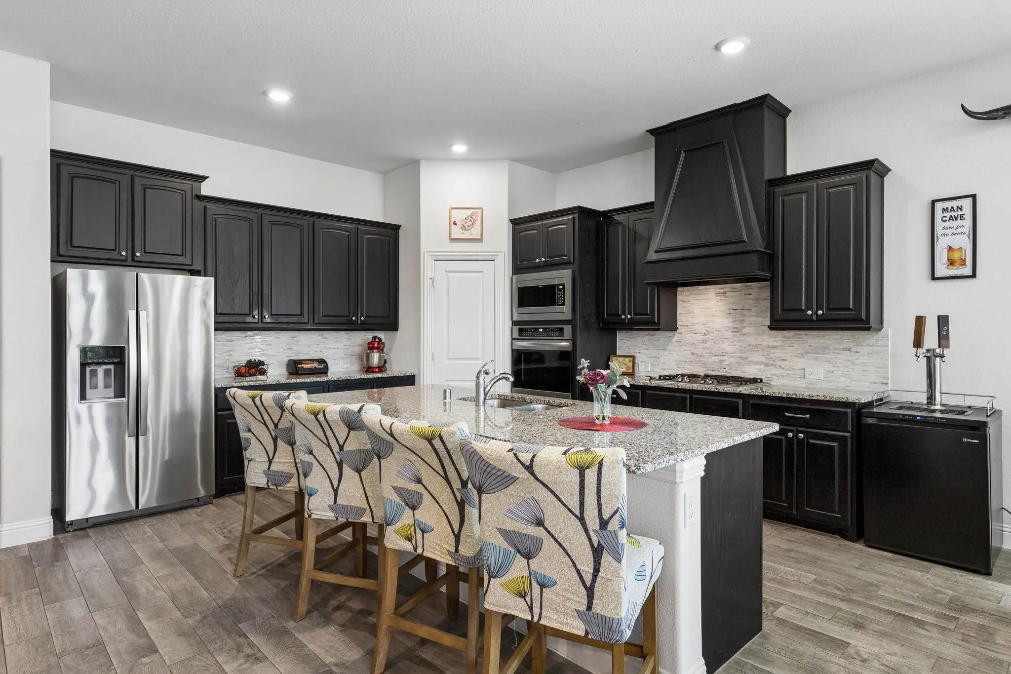 Spacious Kitchen with loads of storage. The double convection oven features a neat Bread Proof feature! And a great gas cooktop!