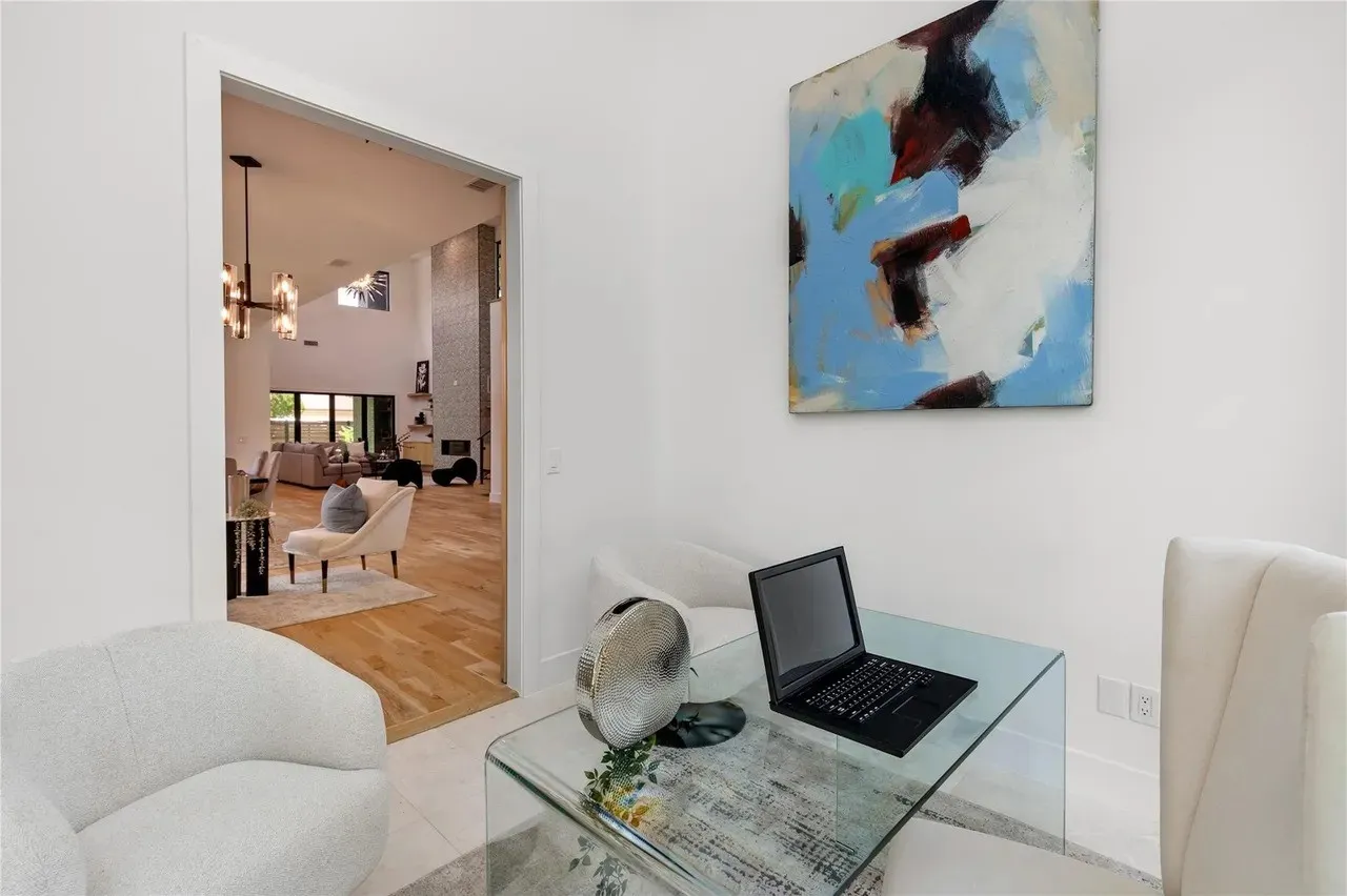 Light-filled interior space with white walls and a wide entryway