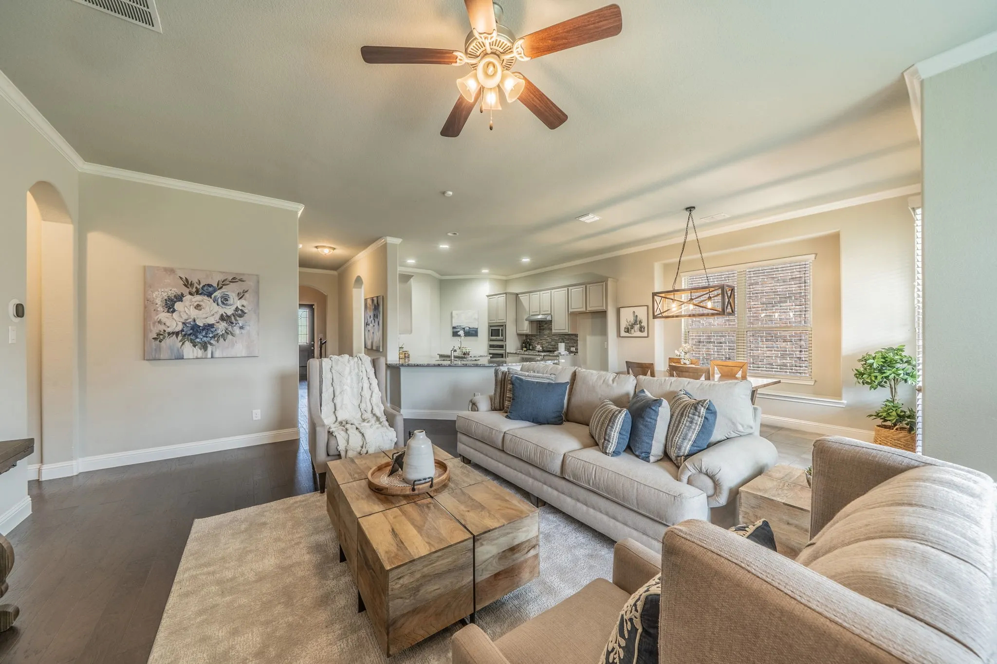 Living room is open to the kitchen and dining areas.