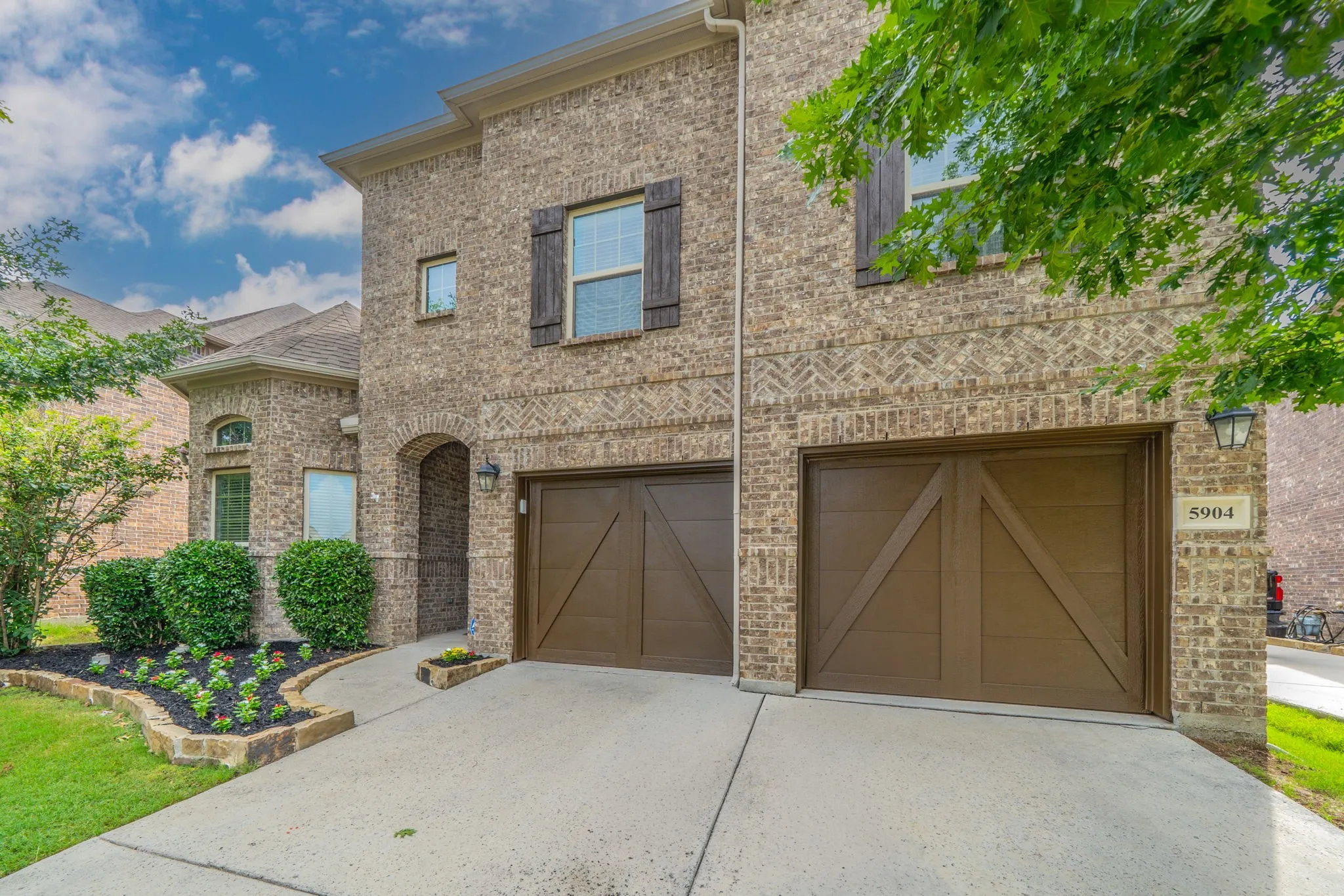 The home features a zoned sprinkler system and an upgraded security system with 2 cameras included