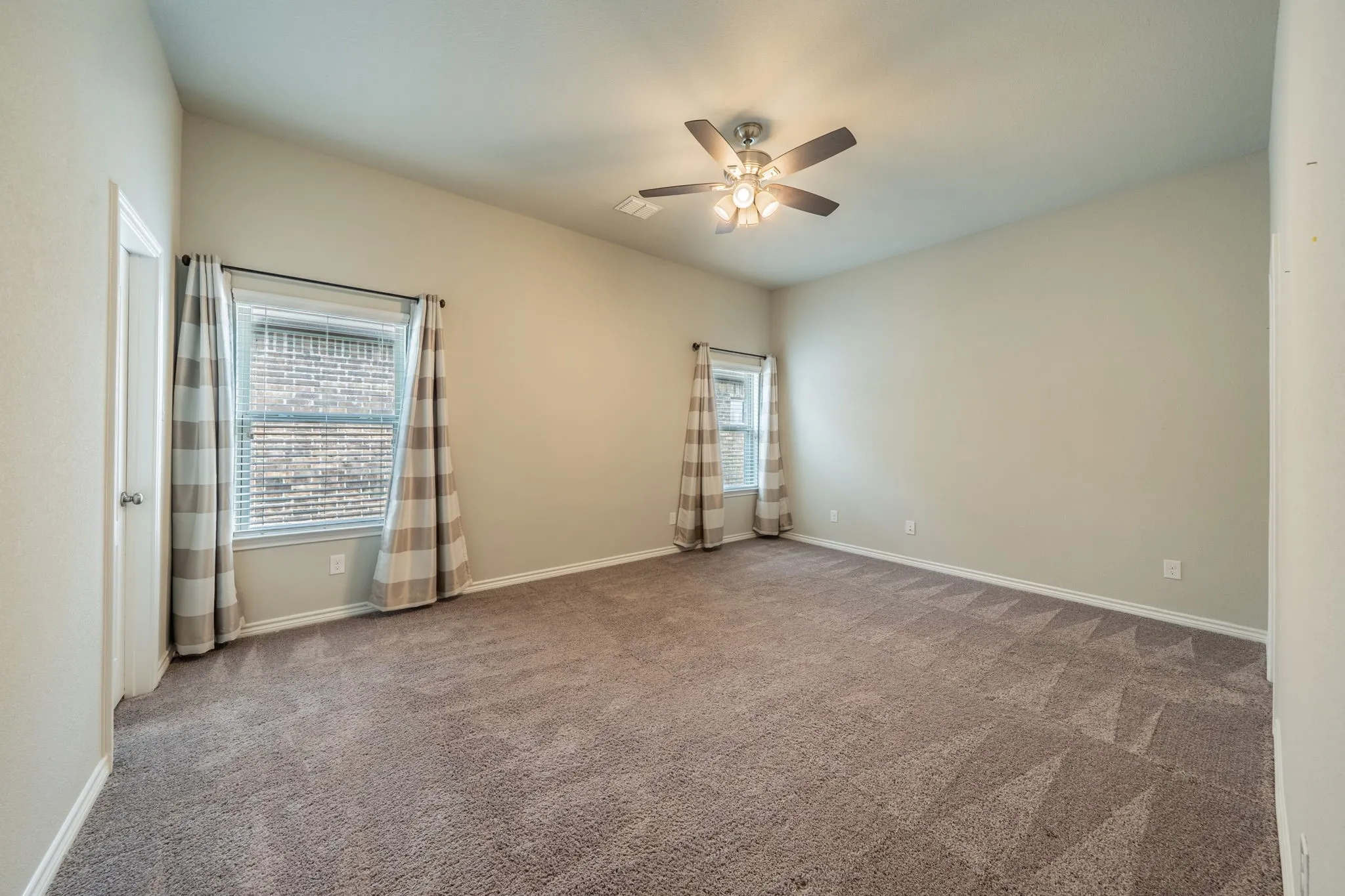 Spacious bedroom with walk-in closet.