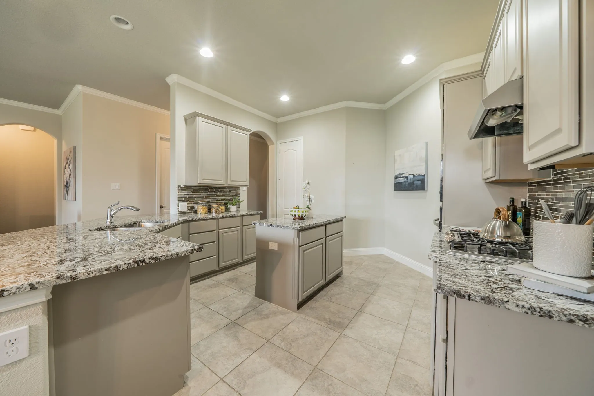 The kitchen features granite counters, stainless steel appliances, a gas cooktop and oven, a newer dishwasher, and a huge walk-in pantry!